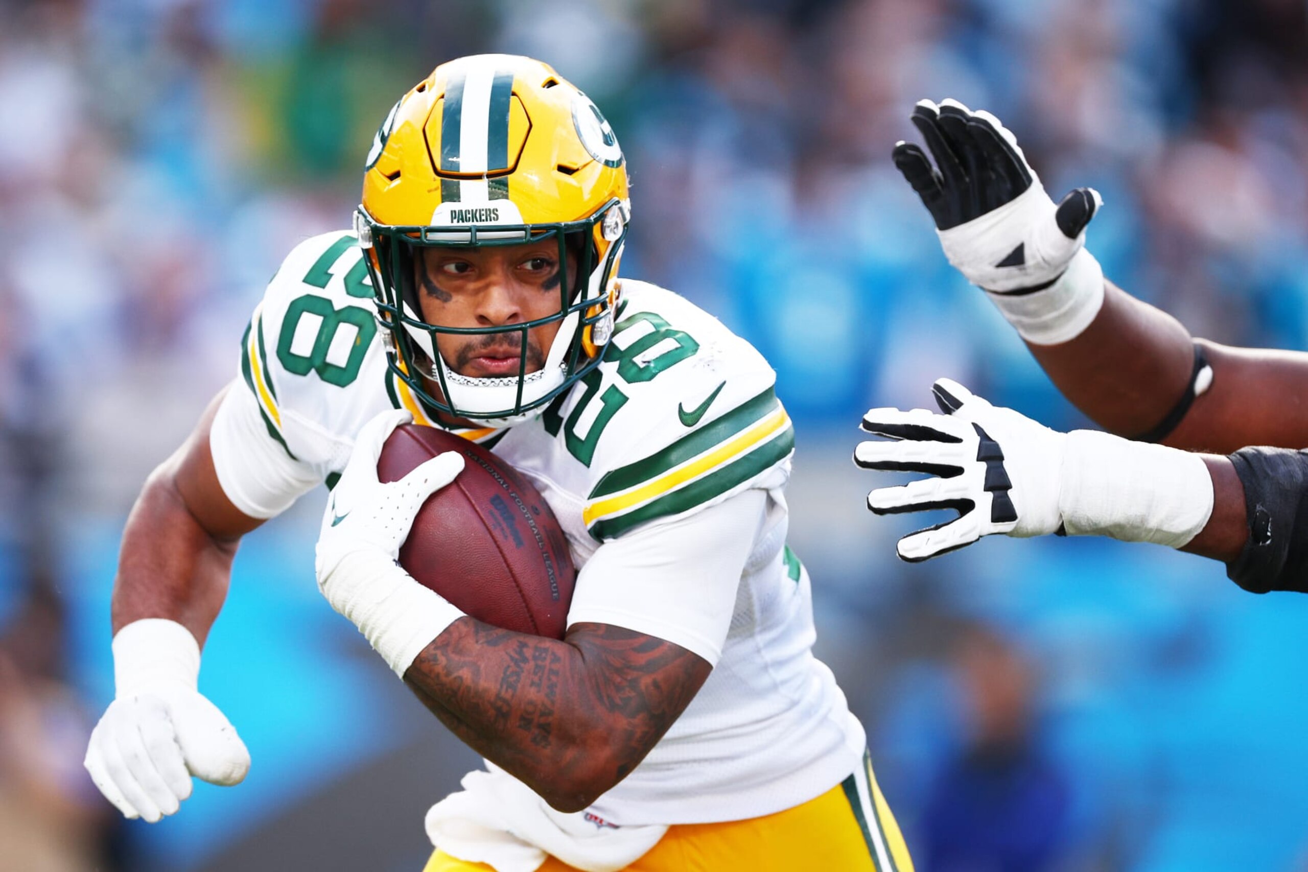 CHARLOTTE, NORTH CAROLINA - DECEMBER 24: AJ Dillon #28 of the Green Bay Packers carries the ball during the fourth quarter against the Carolina Panthers at Bank of America Stadium on December 24, 2023 in Charlotte, North Carolina. (Photo by Jared C. Tilton/Getty Images)