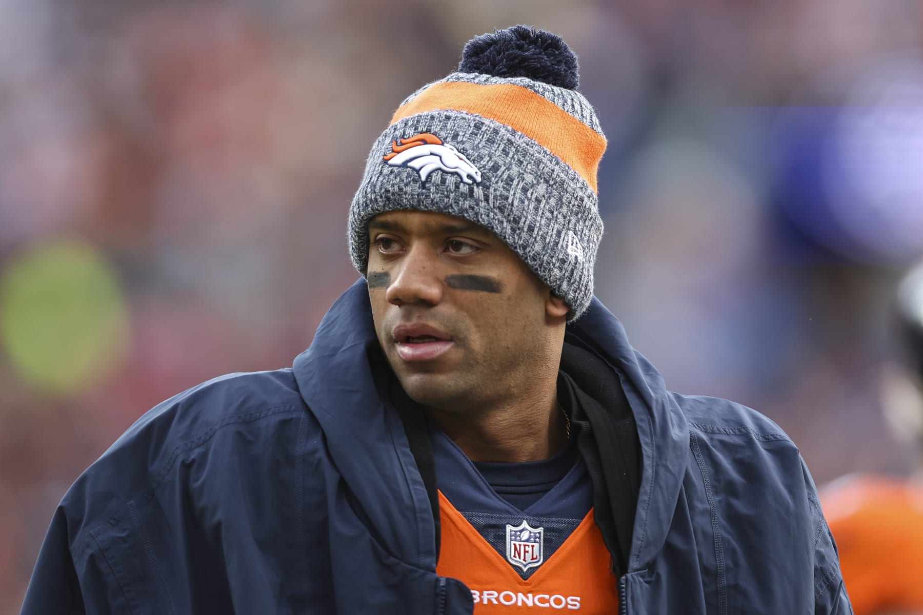 DENVER, CO - DECEMBER 31: Russell Wilson #3 of the Denver Broncos looks on from the sideline during an NFL football game against the Los Angeles Chargers at Empower Field at Mile High on December 31, 2023 in Denver, Colorado. (Photo by Perry Knotts/Getty Images)
