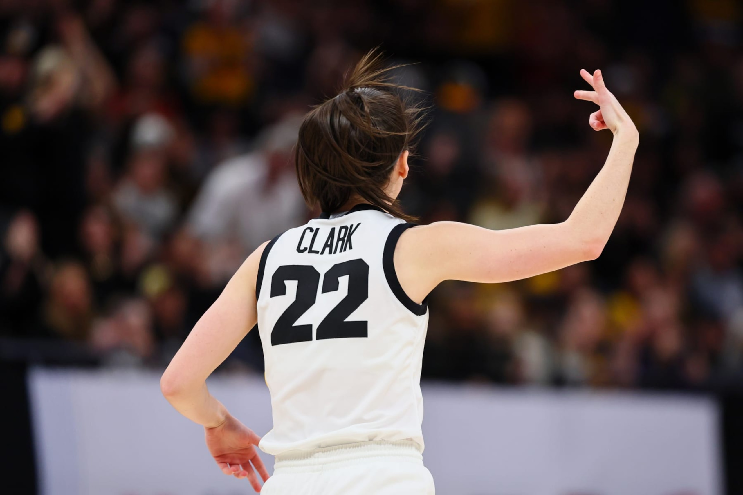 MINNEAPOLIS, MINNESOTA - MARCH 10: Caitlin Clark #22 of the Iowa Hawkeyes reacts after a three point basket in the first half against the Nebraska Cornhuskers during the Big Ten Women's Basketball Tournament Championship at Target Center on March 10, 2024 in Minneapolis, Minnesota. (Photo by Adam Bettcher/Getty Images) MINNEAPOLIS, MINNESOTA - MARCH 10: Caitlin Clark #22 of the Iowa Hawkeyes reacts after a three point basket in the first half against the Nebraska Cornhuskers during the Big Ten Women's Basketball Tournament Championship at Target Center on March 10, 2024 in Minneapolis, Minnesota. (Photo by Adam Bettcher/Getty Images)