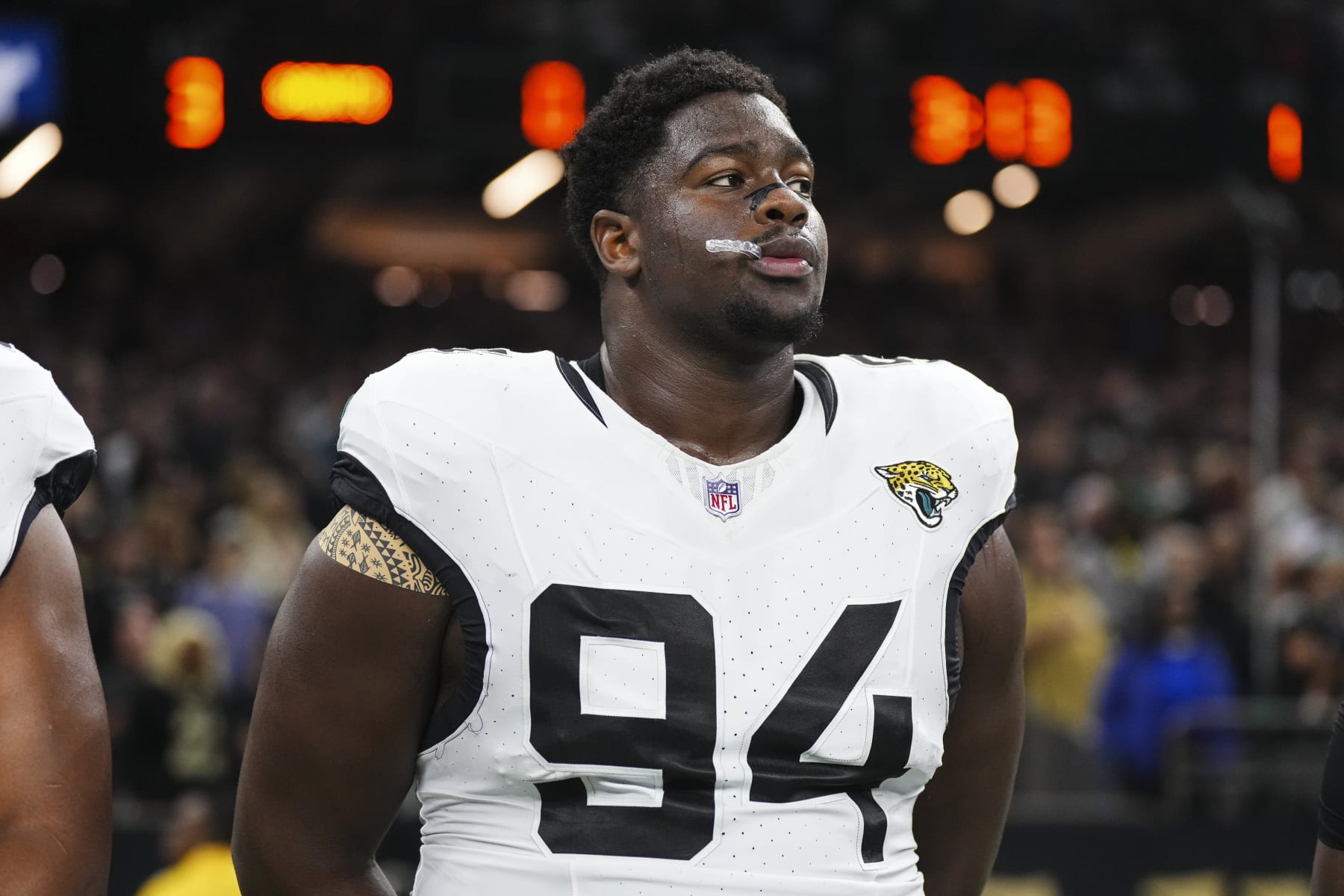 NEW ORLEANS, LA - OCTOBER 19: Folorunso Fatukasi #94 of the Jacksonville Jaguars looks on from the sideline prior to an NFL football game against the New Orleans Saints at Caesars Superdome on October 19, 2023 in New Orleans, Louisiana. (Photo by Cooper Neill/Getty Images) NEW ORLEANS, LA - OCTOBER 19: Folorunso Fatukasi #94 of the Jacksonville Jaguars looks on from the sideline prior to an NFL football game against the New Orleans Saints at Caesars Superdome on October 19, 2023 in New Orleans, Louisiana. (Photo by Cooper Neill/Getty Images)