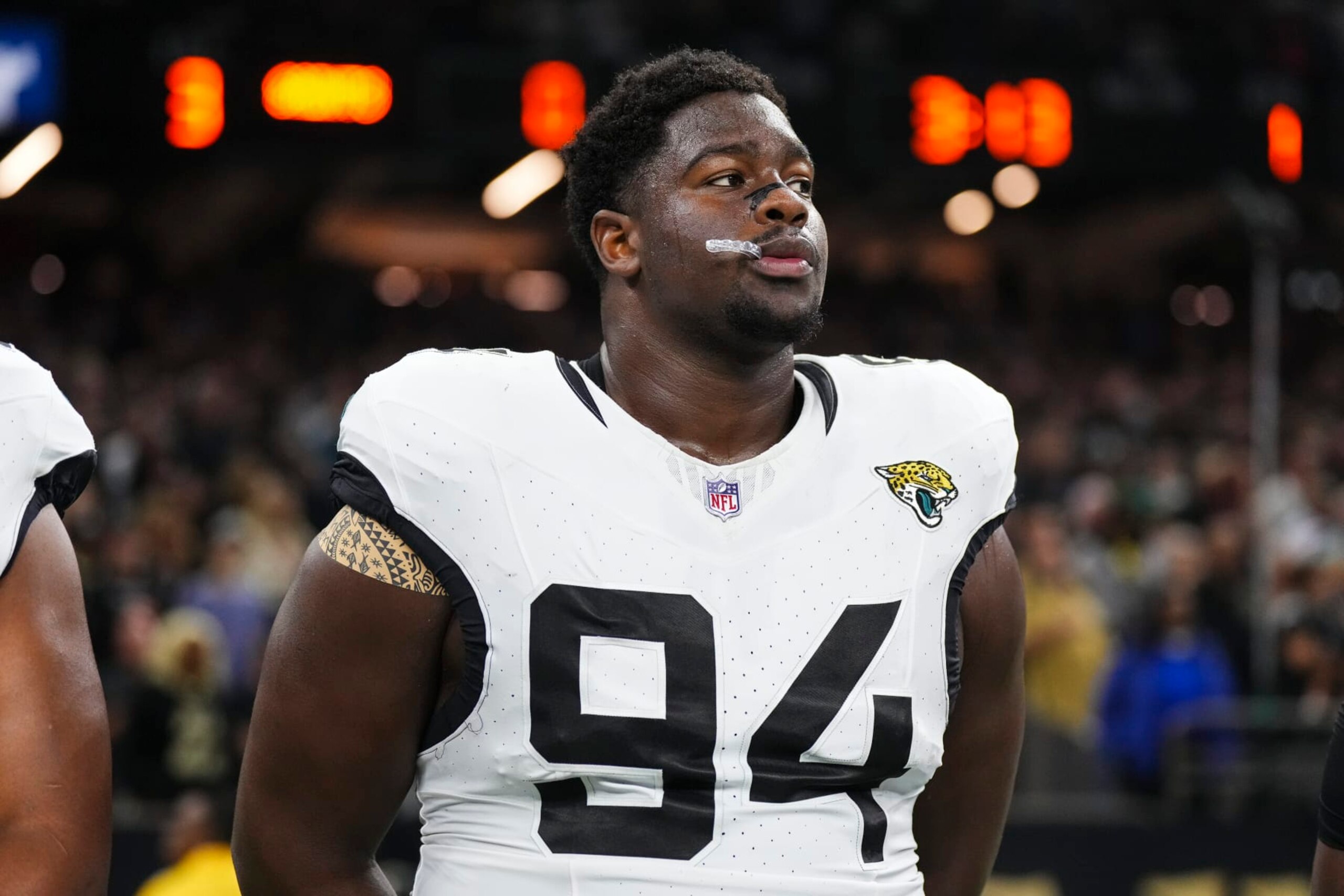 NEW ORLEANS, LA - OCTOBER 19: Folorunso Fatukasi #94 of the Jacksonville Jaguars looks on from the sideline prior to an NFL football game against the New Orleans Saints at Caesars Superdome on October 19, 2023 in New Orleans, Louisiana. (Photo by Cooper Neill/Getty Images)