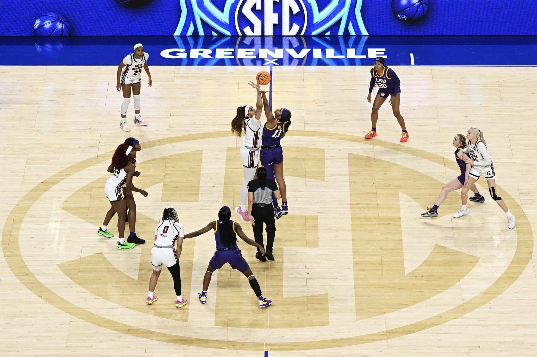 GREENVILLE, SOUTH CAROLINA - MARCH 10: Kamilla Cardoso #10 of the South Carolina Gamecocks and Angel Reese #10 of the LSU Lady Tigers start the game with a jump ball in the first quarter during the championship game of the SEC Women's Basketball Tournament at Bon Secours Wellness Arena on March 10, 2024 in Greenville, South Carolina. (Photo by Eakin Howard/Getty Images)