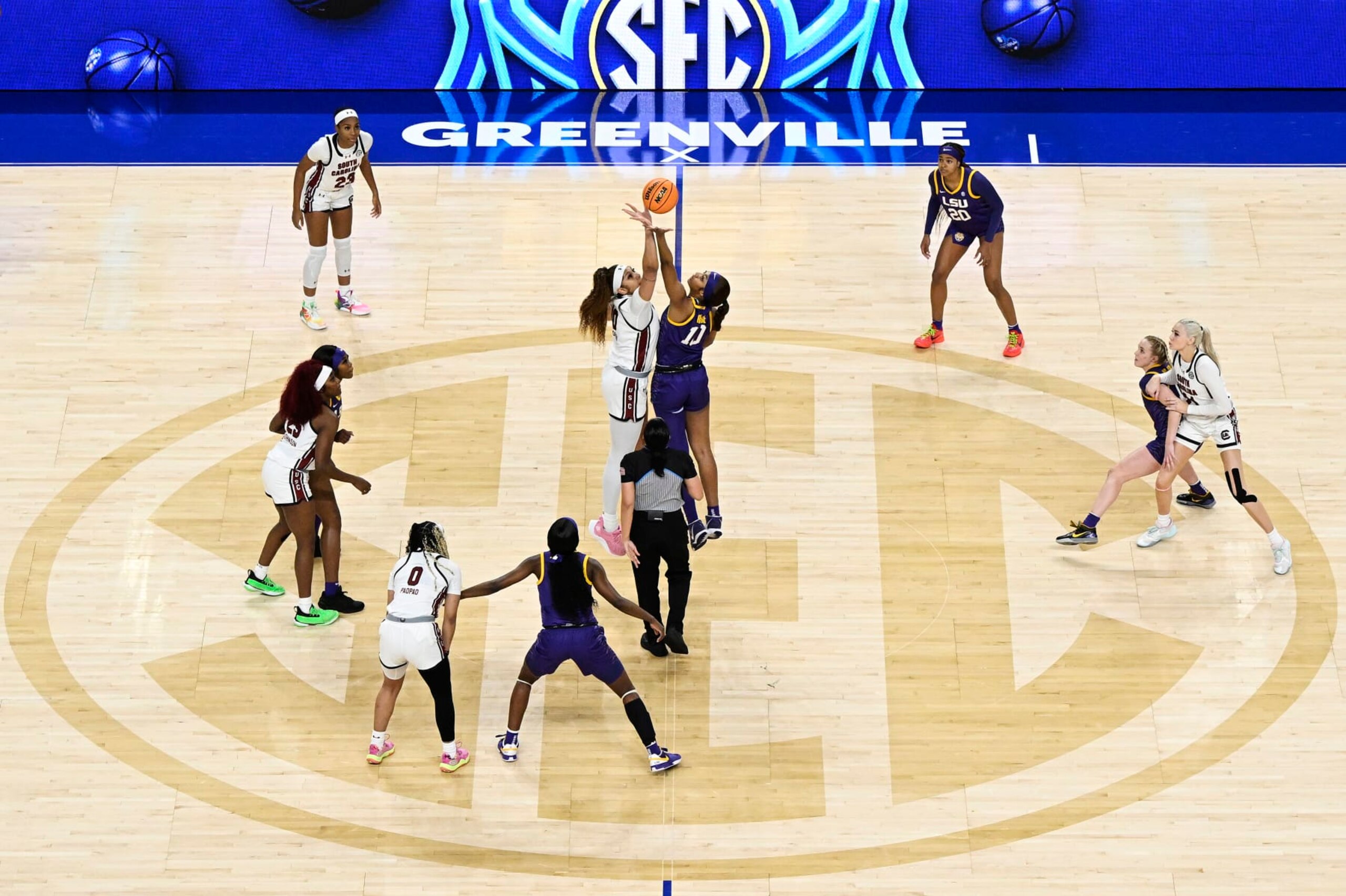 GREENVILLE, SOUTH CAROLINA - MARCH 10: Kamilla Cardoso #10 of the South Carolina Gamecocks and Angel Reese #10 of the LSU Lady Tigers start the game with a jump ball in the first quarter during the championship game of the SEC Women's Basketball Tournament at Bon Secours Wellness Arena on March 10, 2024 in Greenville, South Carolina. (Photo by Eakin Howard/Getty Images)