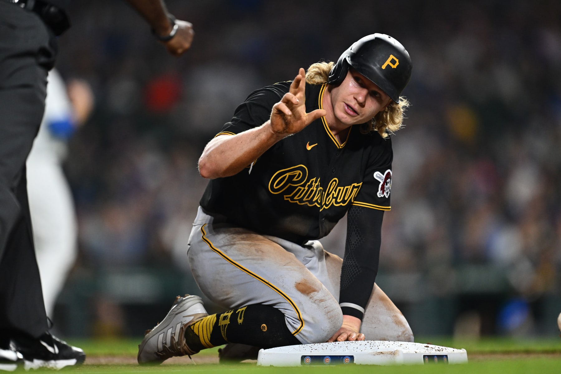 CHICAGO, IL - SEPTEMBER 21:  Jack Suwinski #65 of the Pittsburgh Pirates asks the umpire for a timeout after stealing third base in the fifth inning against the Chicago Cubs at Wrigley Field on September 21, 2023 in Chicago, Illinois.  (Photo by Jamie Sabau/Getty Images)