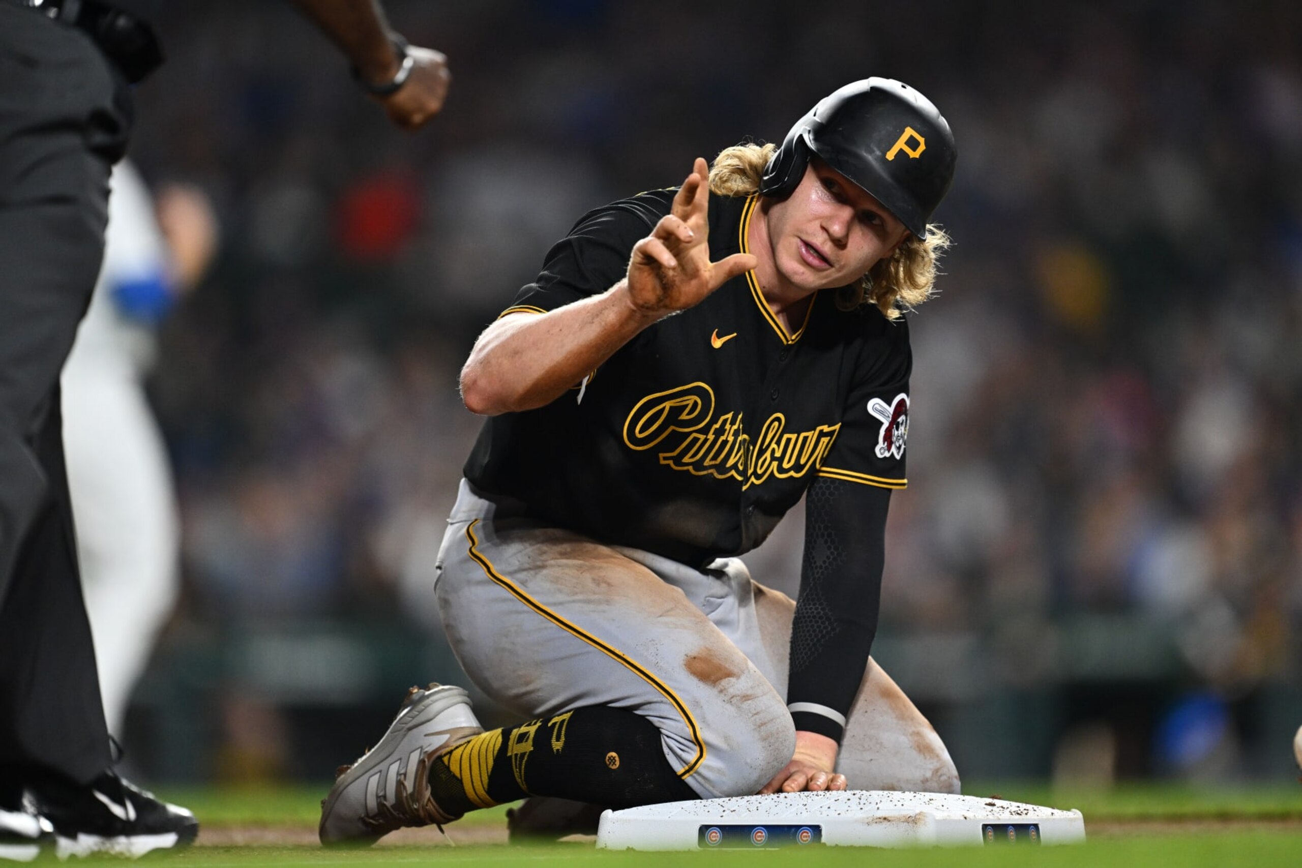CHICAGO, IL - SEPTEMBER 21:  Jack Suwinski #65 of the Pittsburgh Pirates asks the umpire for a timeout after stealing third base in the fifth inning against the Chicago Cubs at Wrigley Field on September 21, 2023 in Chicago, Illinois.  (Photo by Jamie Sabau/Getty Images)