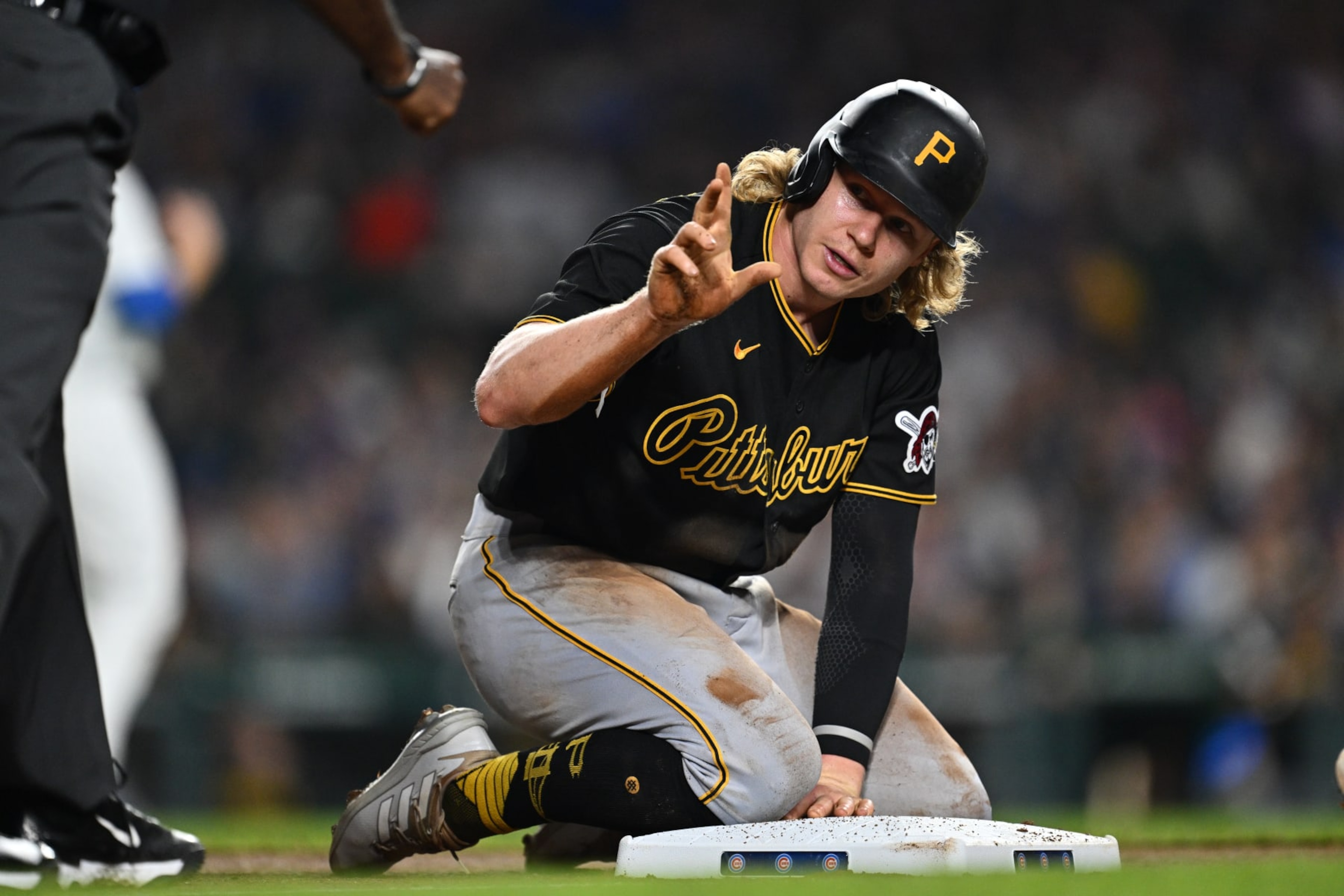 CHICAGO, IL - SEPTEMBER 21:  Jack Suwinski #65 of the Pittsburgh Pirates asks the umpire for a timeout after stealing third base in the fifth inning against the Chicago Cubs at Wrigley Field on September 21, 2023 in Chicago, Illinois.  (Photo by Jamie Sabau/Getty Images)