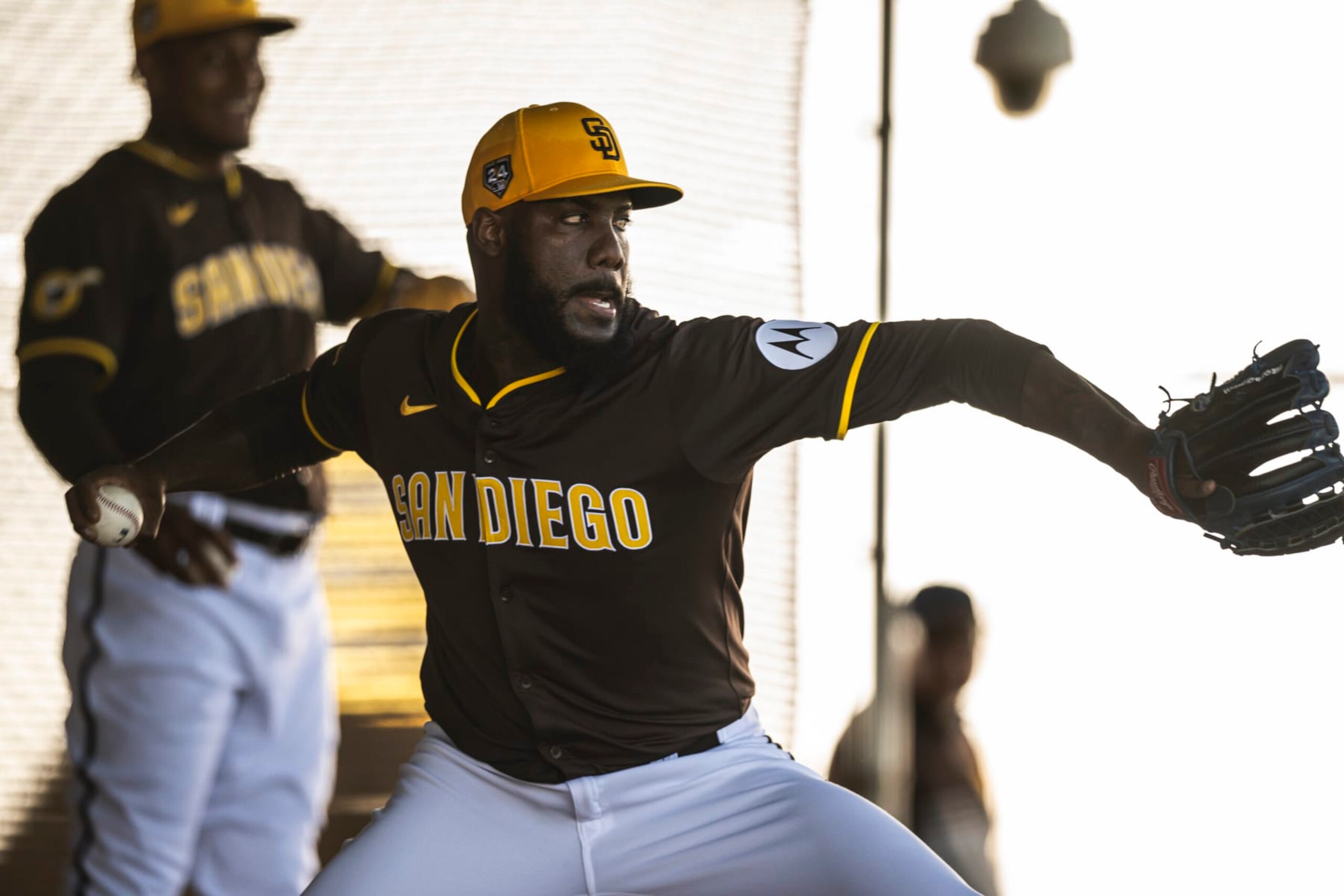 PEORIA, ARIZONA - FEBRUARY 14: Enyel De los Santos #62 of the San Diego Padres pitches during a bullpen session during the daily workout at Peoria Sports Complex on February 14, 2024 in Peoria, Arizona. (Photo by Matt Thomas/San Diego Padres/Getty Images)