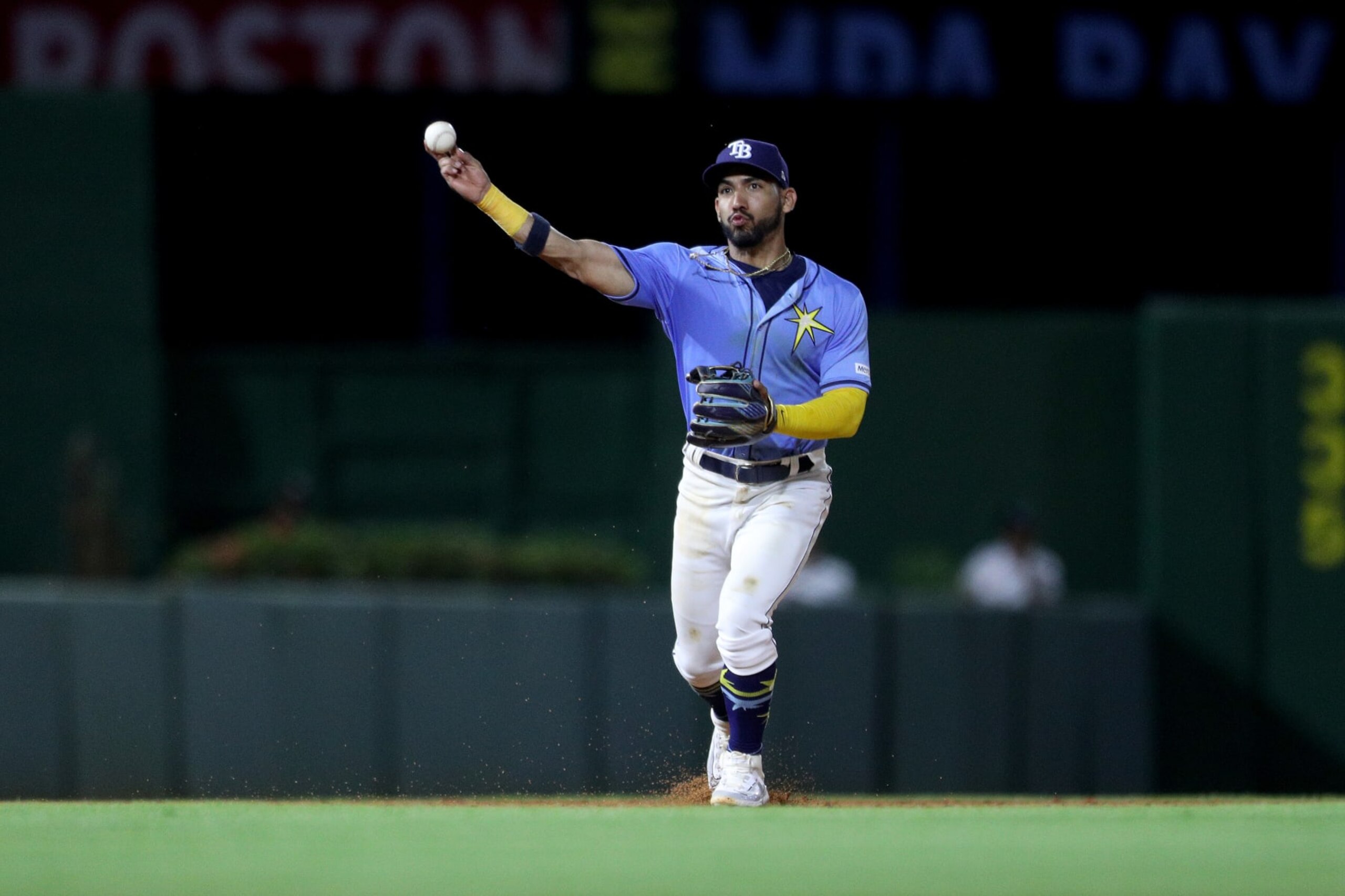 SANTO DOMINGO, DOMINICAN REPUBLIC - MARCH 09: Amed Rosario #10 of the Tampa Bay Rays throws the ball during the ninth inning against the Boston Red Sox at Estadio Quisqueya on March 09, 2024 in Santo Domingo, Dominican Republic. (Photo by Bryan M. Bennett/Getty Images)