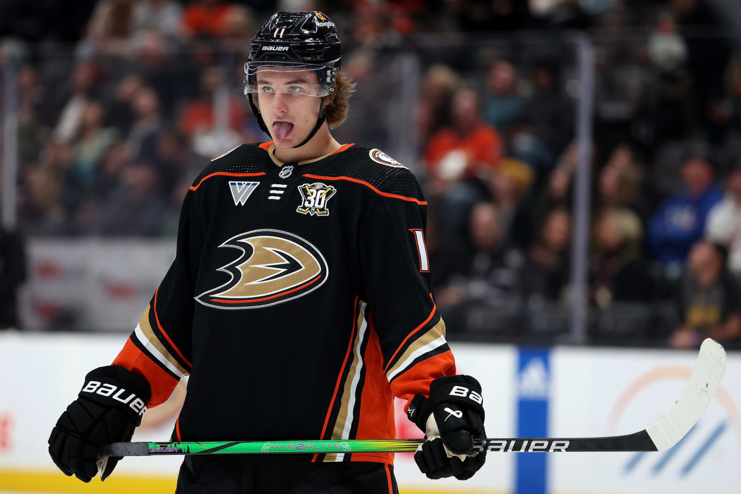 ANAHEIM, CALIFORNIA - JANUARY 05: Trevor Zegras #11 of the Anaheim Ducks looks on prior to a face off during the second period of a game against the Winnipeg Jets at Honda Center on January 05, 2024 in Anaheim, California. (Photo by Sean M. Haffey/Getty Images)