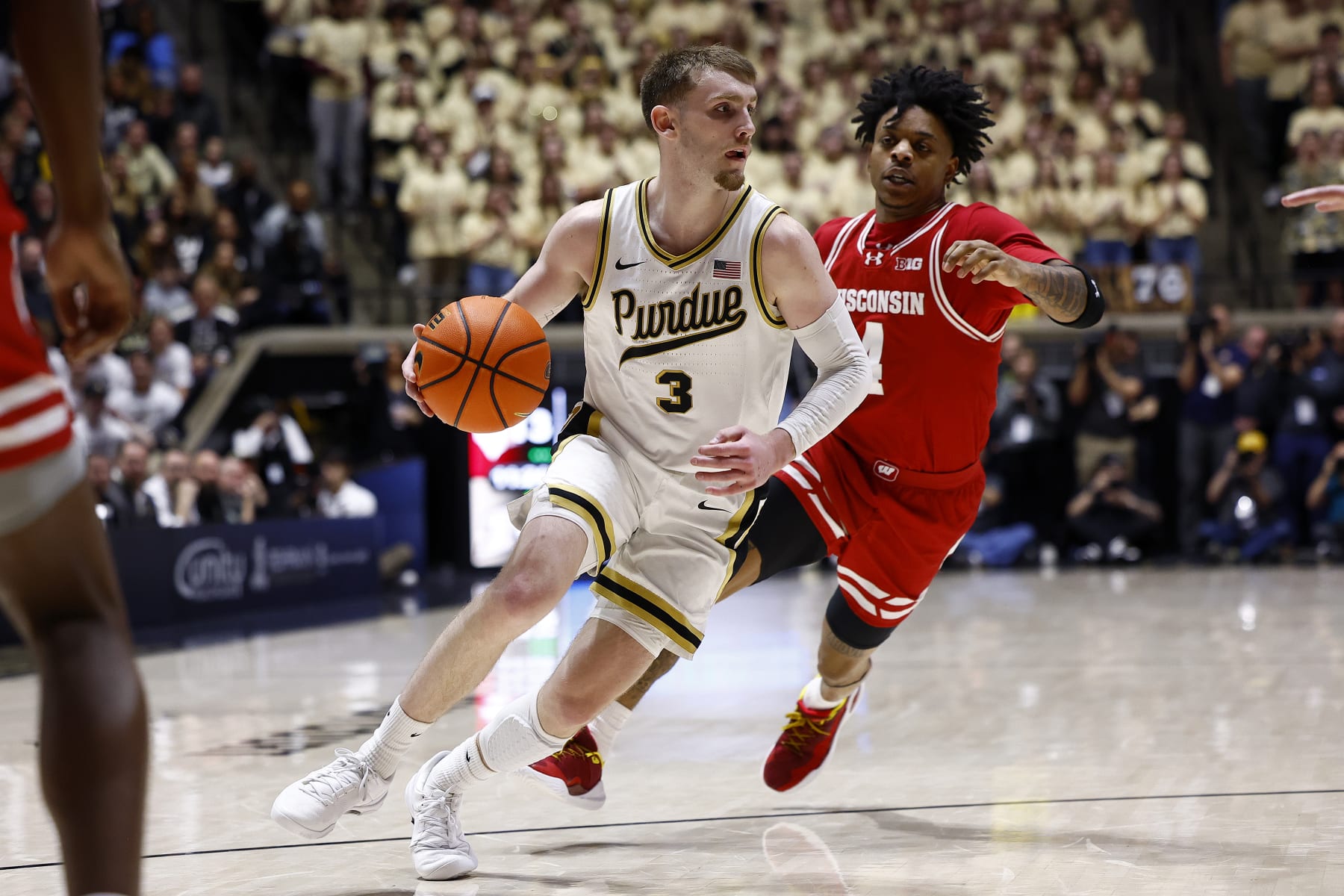 WEST LAFAYETTE, IN - MARCH 10: Purdue Boilermakers guard Braden Smith (3) drives past Wisconsin Badgers guard Kamari McGee (4) in the first half of play during a mens college basketball game between the Wisconsin Badgers and the Purdue Boilermakers on March 10, 2024 at Mackey Arena in West Lafayette, IN.(Photo by Jeffrey Brown/Icon Sportswire via Getty Images)