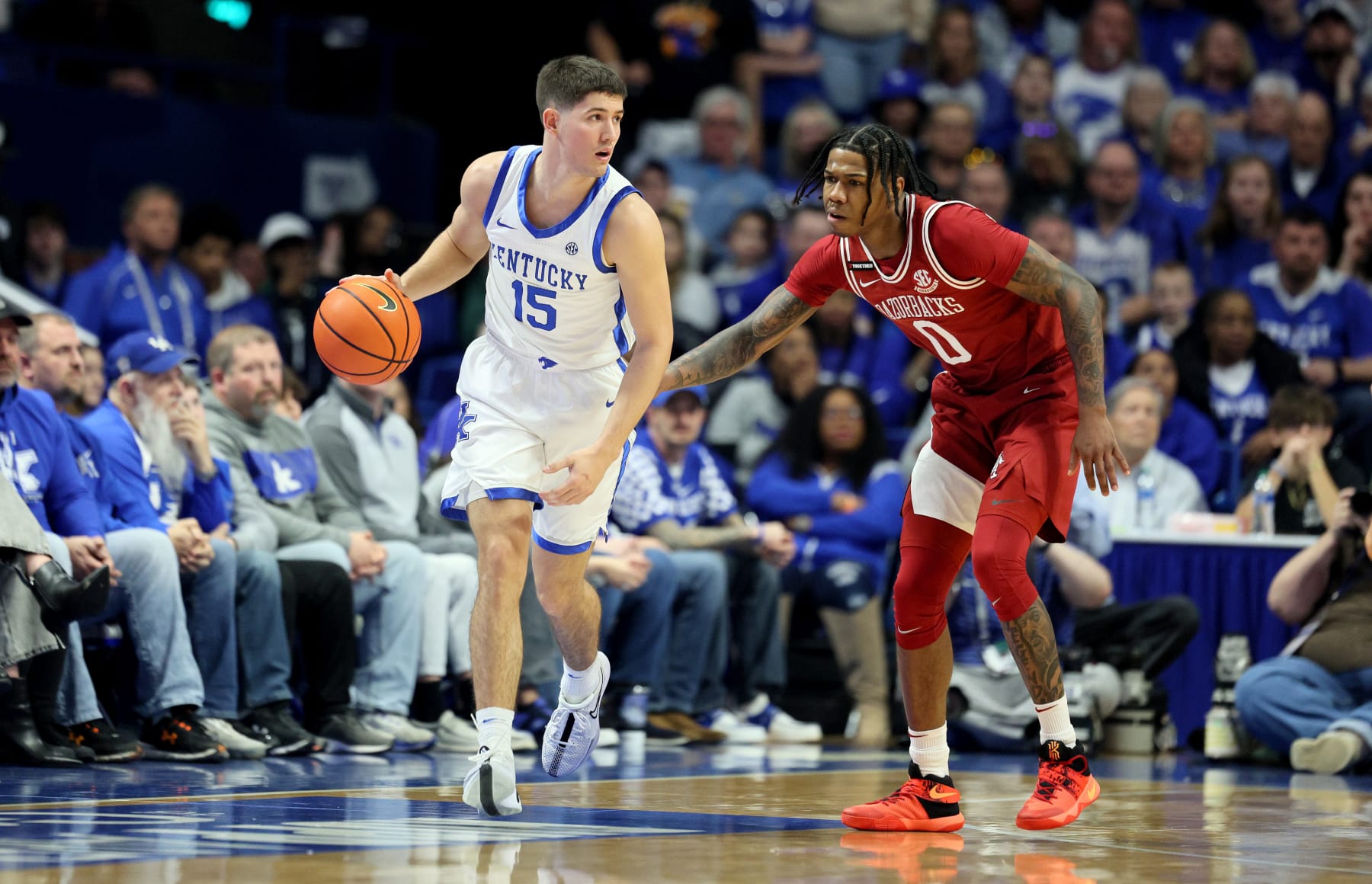 LEXINGTON, KENTUCKY - MARCH 02: Reed Sheppard #15 of the Kentucky Wildcats dribbles the ball while defended by  Khalif Battle #0 of the Arkansas Razorbacks at Rupp Arena on March 02, 2024 in Lexington, Kentucky. (Photo by Andy Lyons/Getty Images)
