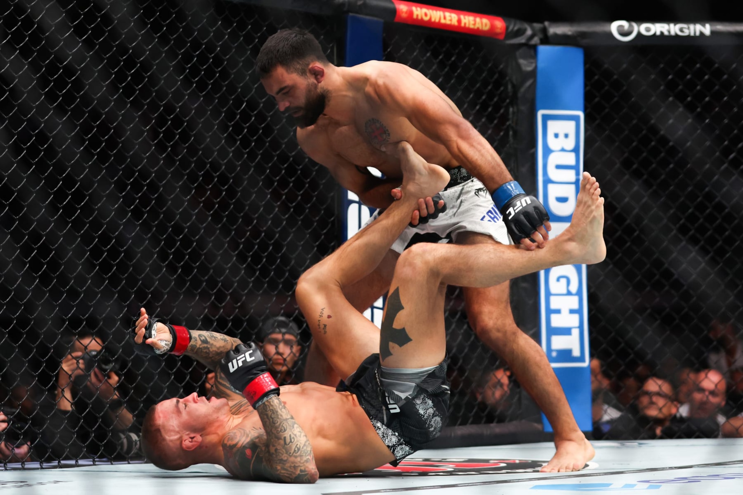 MIAMI, FLORIDA - MARCH 09: Dustin Poirier fights Benoit Saint Denis of France during their lightweight bout at UFC 299 at Kaseya Center on March 09, 2024 in Miami, Florida. (Photo by Megan Briggs/Getty Images)