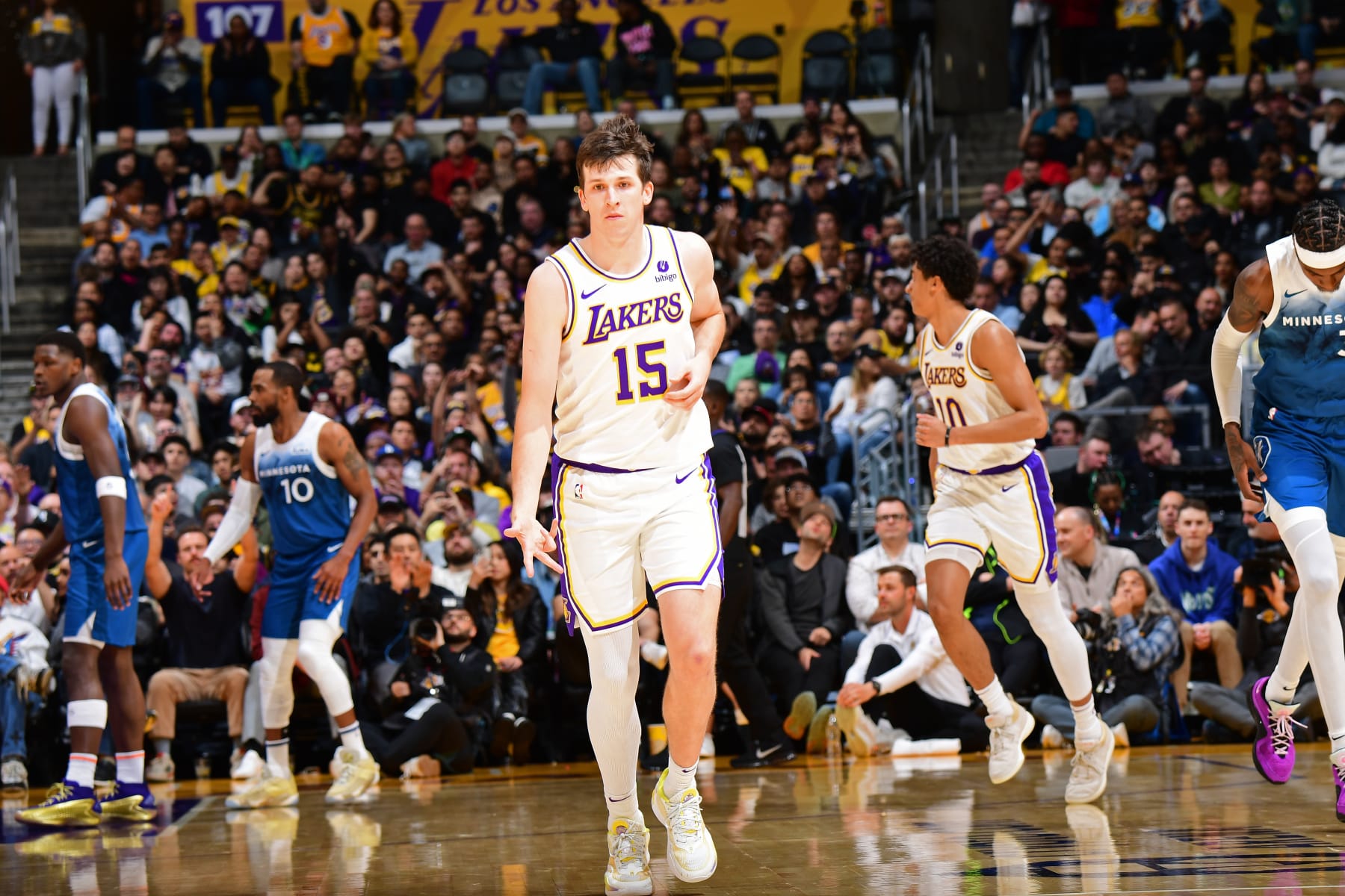 LOS ANGELES, CA - MARCH 10: Austin Reaves #15 of the Los Angeles Lakers celebrates during the game against the Minnesota Timberwolves on March 10, 2024 at Crypto.Com Arena in Los Angeles, California. NOTE TO USER: User expressly acknowledges and agrees that, by downloading and/or using this Photograph, user is consenting to the terms and conditions of the Getty Images License Agreement. Mandatory Copyright Notice: Copyright 2024 NBAE (Photo by Adam Pantozzi/NBAE via Getty Images)