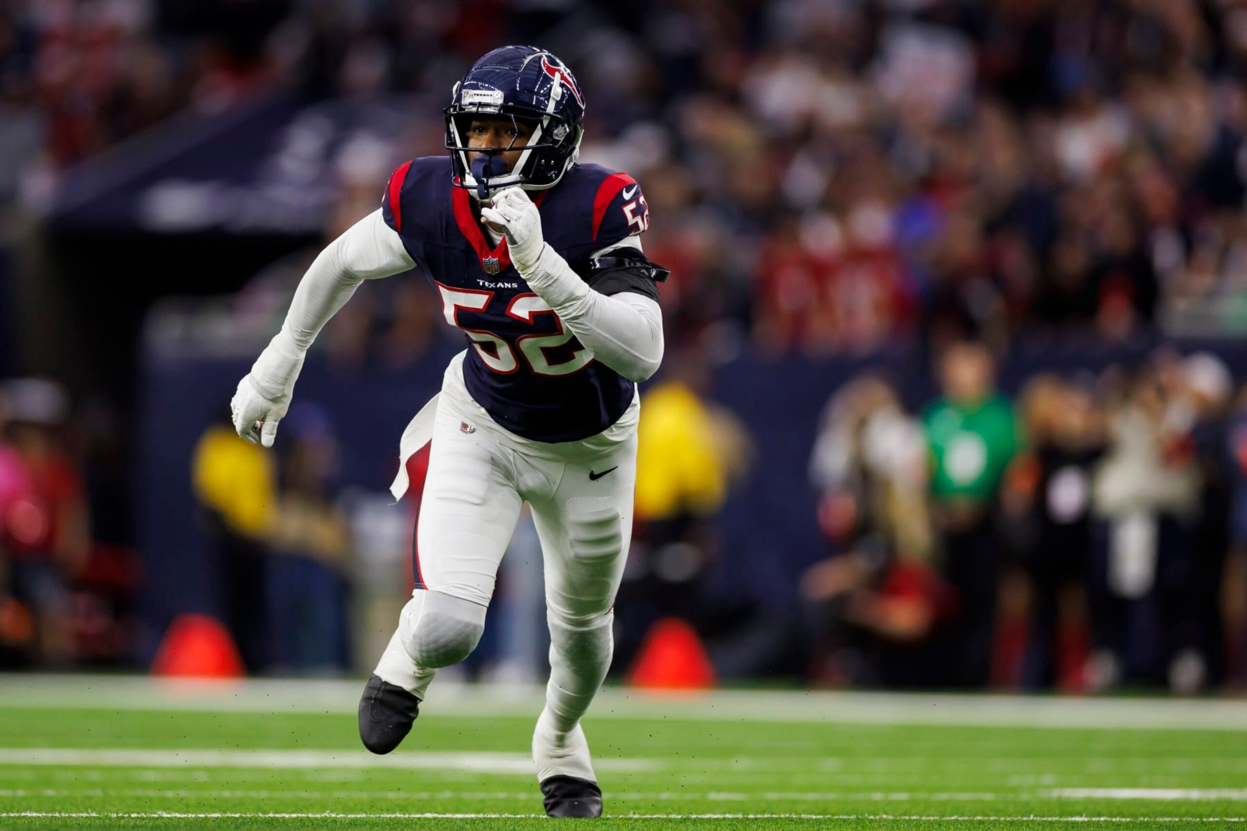 HOUSTON, TEXAS - JANUARY 13: Jonathan Greenard #52 of the Houston Texans runs around the edge during an AFC wild-card playoff football game against the Cleveland Browns at NRG Stadium on January 13, 2024 in Houston, Texas. (Photo by Ryan Kang/Getty Images)
