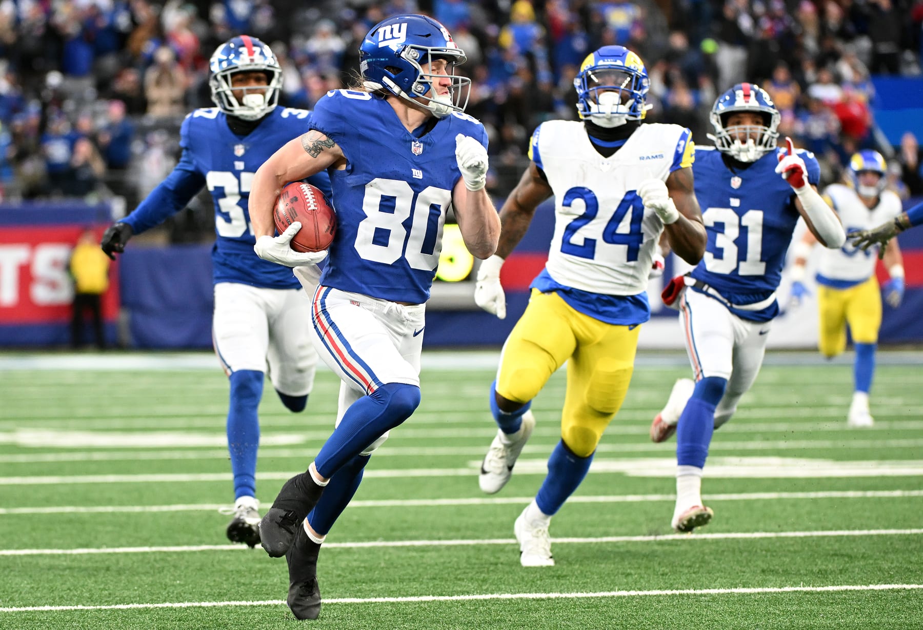 EAST RUTHERFORD, NEW JERSEY - DECEMBER 31: Gunner Olszewski #80 of the New York Giants carries the ball for a touchdown against the Los Angeles Rams during the fourth quarter of the game at MetLife Stadium on December 31, 2023 in East Rutherford, New Jersey. (Photo by Mike Lawrence/Getty Images) EAST RUTHERFORD, NEW JERSEY - DECEMBER 31: Gunner Olszewski #80 of the New York Giants carries the ball for a touchdown against the Los Angeles Rams during the fourth quarter of the game at MetLife Stadium on December 31, 2023 in East Rutherford, New Jersey. (Photo by Mike Lawrence/Getty Images)