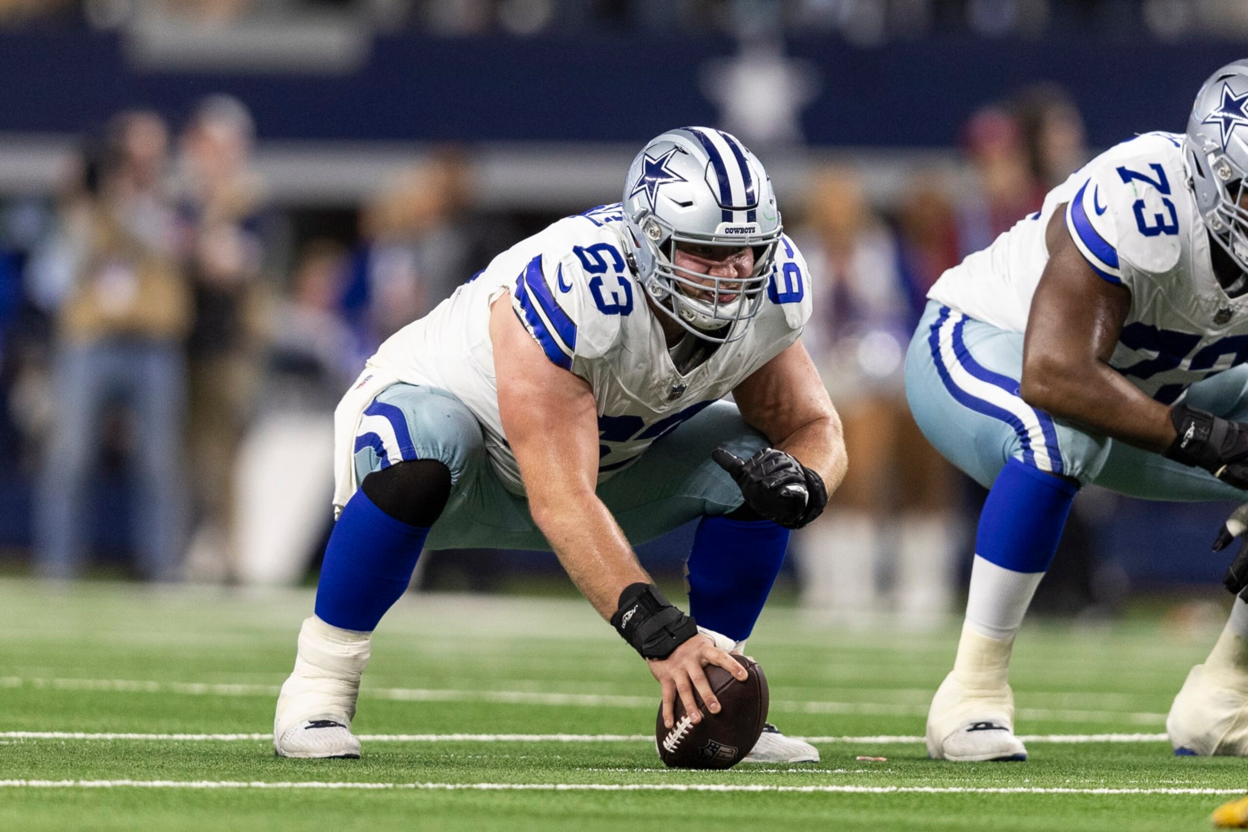 ARLINGTON, TEXAS - JANUARY 14: Tyler Biadasz #63 of the Dallas Cowboys lines up during an NFL wild-card playoff football game between the Dallas Cowboys and the Green Bay Packers at AT&T Stadium on January 14, 2024 in Arlington, Texas. (Photo by Michael Owens/Getty Images)
