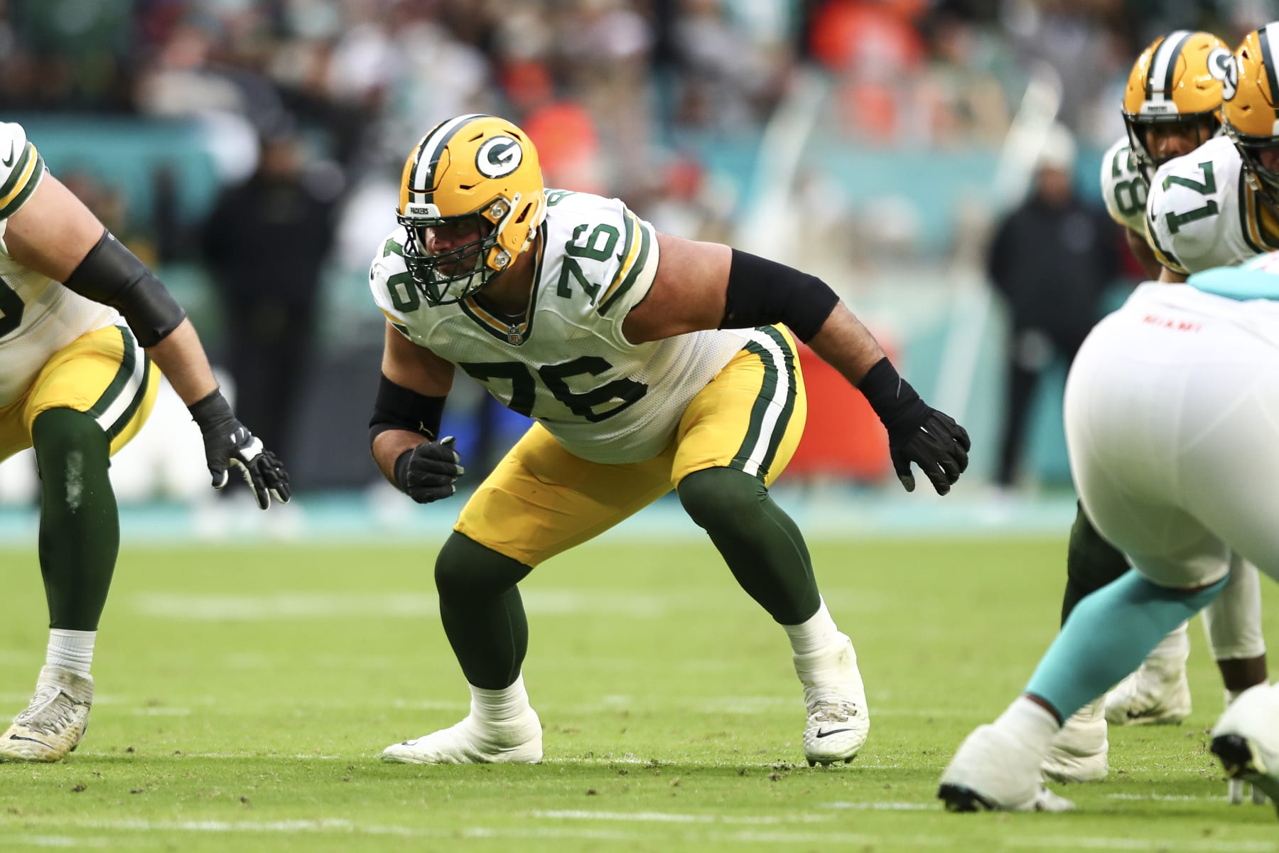 MIAMI GARDENS, FL - DECEMBER 25: Jon Runyan #76 of the Green Bay Packers blocks during an NFL football game against the Miami Dolphins, Sunday at Hard Rock Stadium on December 25, 2023 in Miami Gardens, Florida. (Photo by Kevin Sabitus/Getty Images) MIAMI GARDENS, FL - DECEMBER 25: Jon Runyan #76 of the Green Bay Packers blocks during an NFL football game against the Miami Dolphins, Sunday at Hard Rock Stadium on December 25, 2023 in Miami Gardens, Florida. (Photo by Kevin Sabitus/Getty Images)