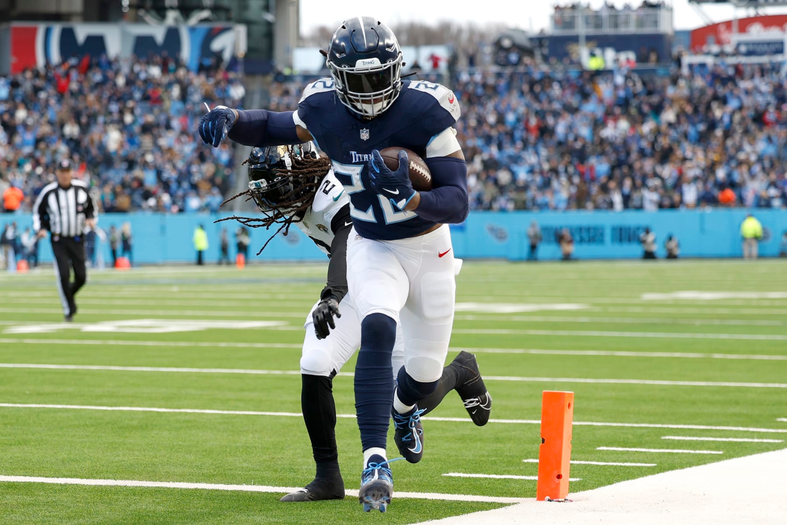 NASHVILLE, TENNESSEE - JANUARY 07: Derrick Henry #22 of the Tennessee Titans runs with the ball for a touchdown during the second quarter against the Jacksonville Jaguars at Nissan Stadium on January 07, 2024 in Nashville, Tennessee. (Photo by Wesley Hitt/Getty Images) NASHVILLE, TENNESSEE - JANUARY 07: Derrick Henry #22 of the Tennessee Titans runs with the ball for a touchdown during the second quarter against the Jacksonville Jaguars at Nissan Stadium on January 07, 2024 in Nashville, Tennessee. (Photo by Wesley Hitt/Getty Images)