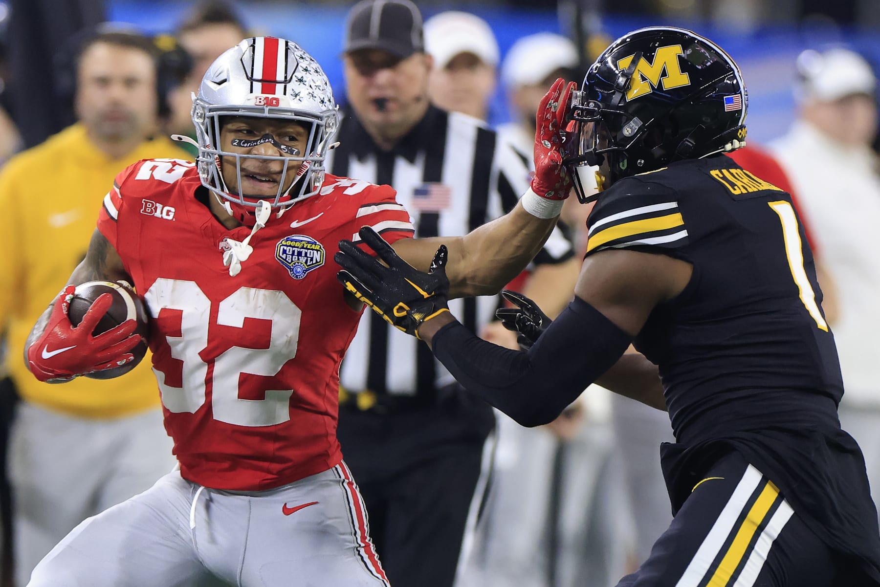 ARLINGTON, TEXAS - DECEMBER 29: TreVeyon Henderson #32 of the Ohio State Buckeyes runs the ball against Jaylon Carlies #1 of the Missouri Tigers during the first quarter in the Goodyear Cotton Bowl at AT&T Stadium on December 29, 2023 in Arlington, Texas. (Photo by Ron Jenkins/Getty Images)