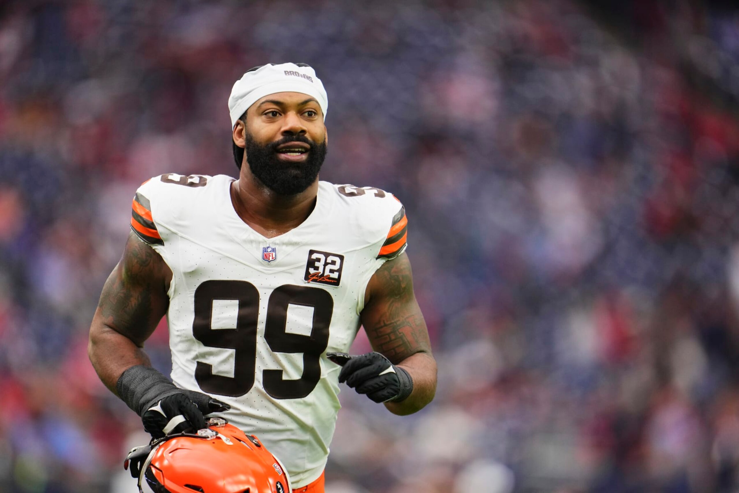 HOUSTON, TX - JANUARY 13: Za'Darius Smith #99 of the Cleveland Browns jogs off the field before kickoff against the Houston Texans in the AFC Wild Card playoff game at NRG Stadium on January 13, 2024 in Houston, Texas. (Photo by Cooper Neill/Getty Images)