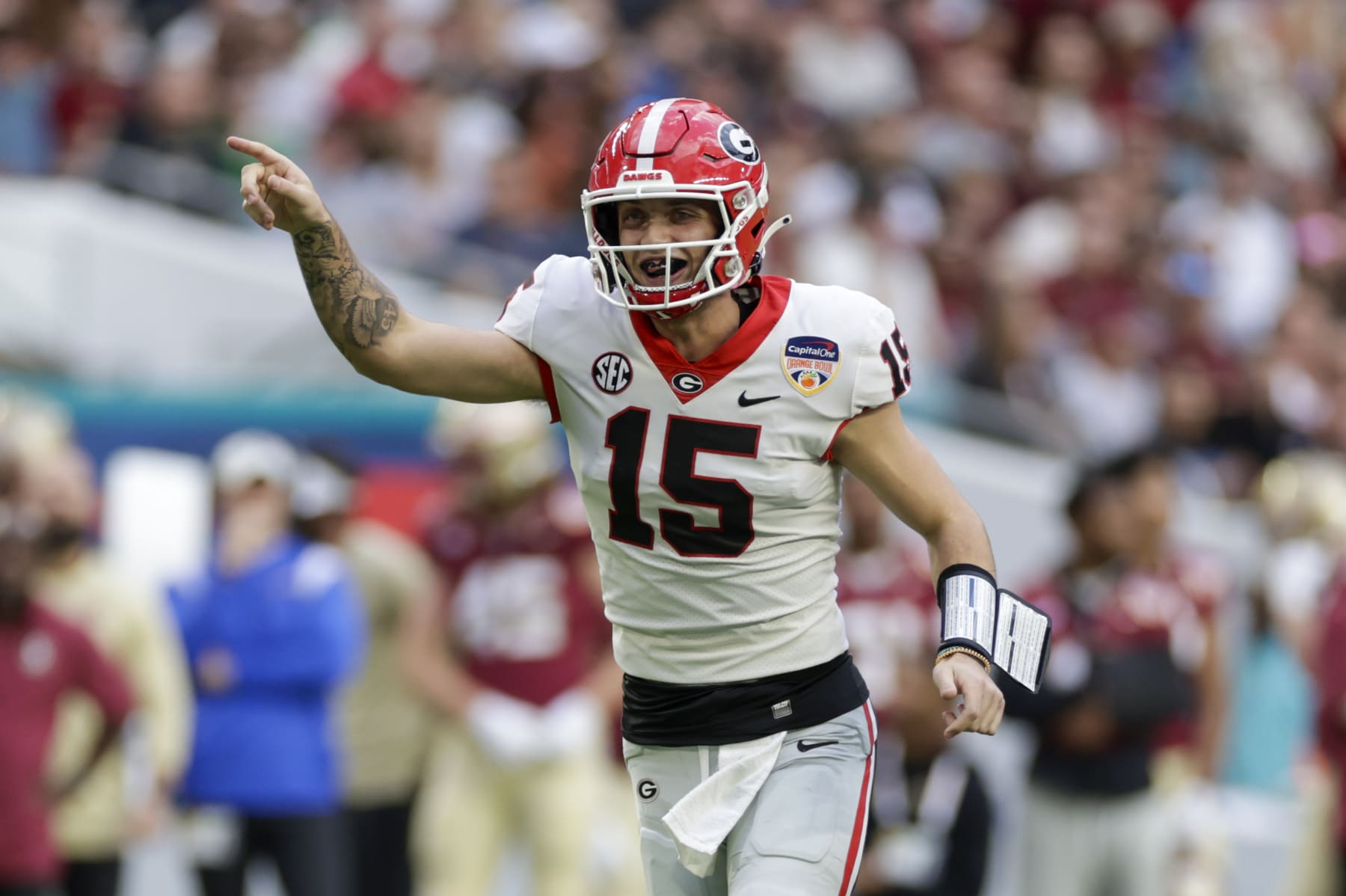 MIAMI GARDENS, FL - DECEMBER 30: Georgia Bulldogs quarterback Carson Beck (15) reacts after a touchdown during the game between the Georgia Bulldogs and the Florida State Seminoles on December 30, 2023 at Hard Rock Stadium in Miami Gardens, Fl.  (Photo by David Rosenblum/Icon Sportswire via Getty Images)