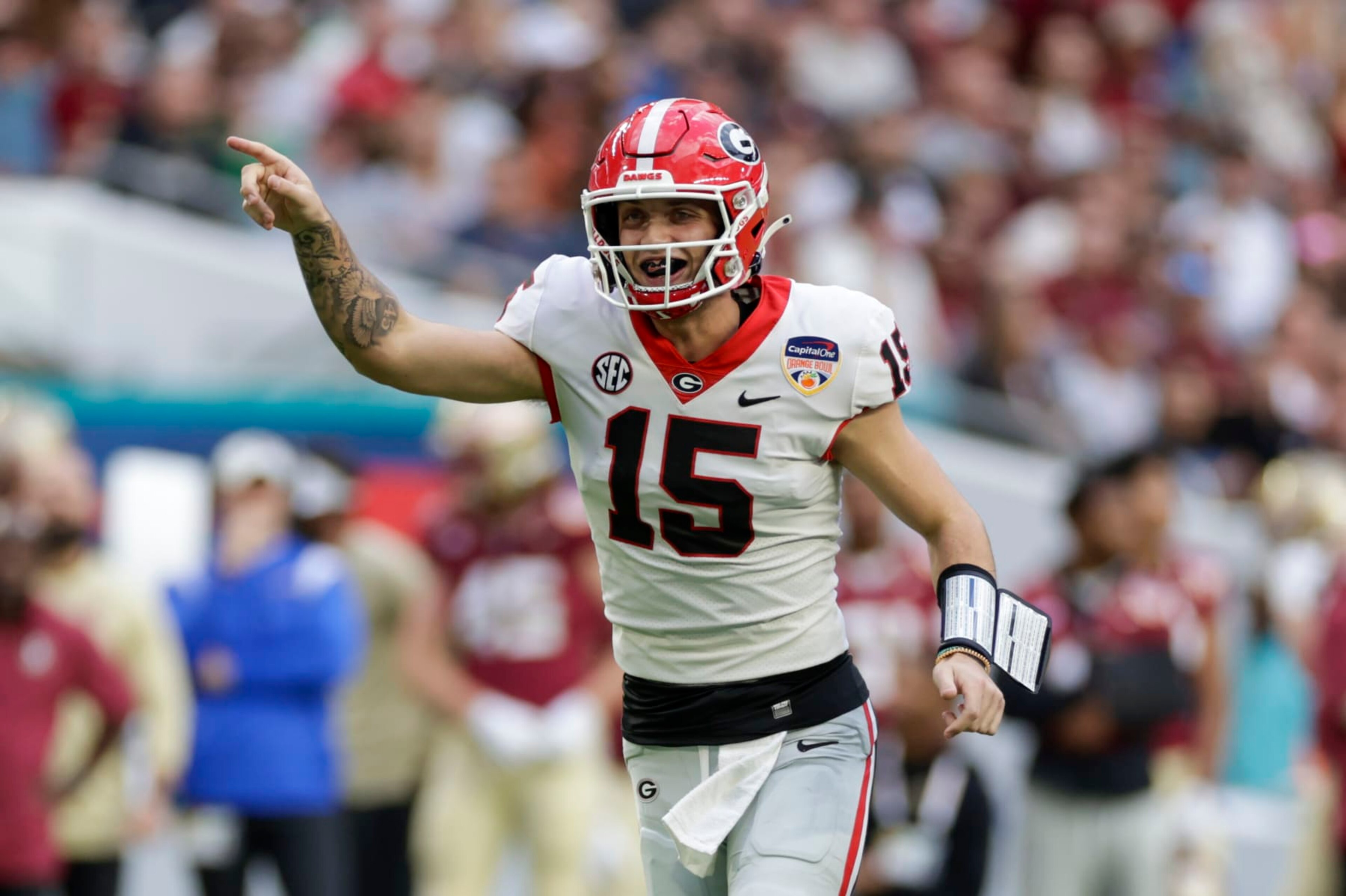 MIAMI GARDENS, FL - DECEMBER 30: Georgia Bulldogs quarterback Carson Beck (15) reacts after a touchdown during the game between the Georgia Bulldogs and the Florida State Seminoles on December 30, 2023 at Hard Rock Stadium in Miami Gardens, Fl.  (Photo by David Rosenblum/Icon Sportswire via Getty Images)
