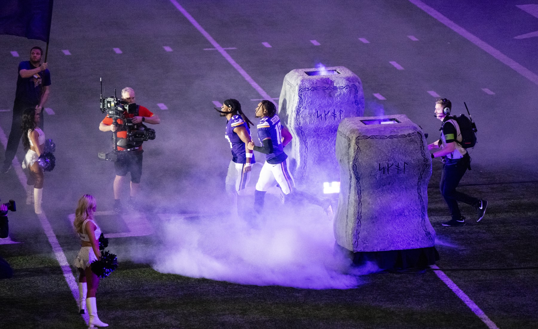 MINNEAPOLIS, MINNESOTA - DECEMBER 31: Justin Jefferson #18 and K.J. Osborn #17 of the Minnesota Vikings take the field before the game against the Green Bay Packers at U.S. Bank Stadium on December 31, 2023 in Minneapolis, Minnesota. (Photo by Stephen Maturen/Getty Images)