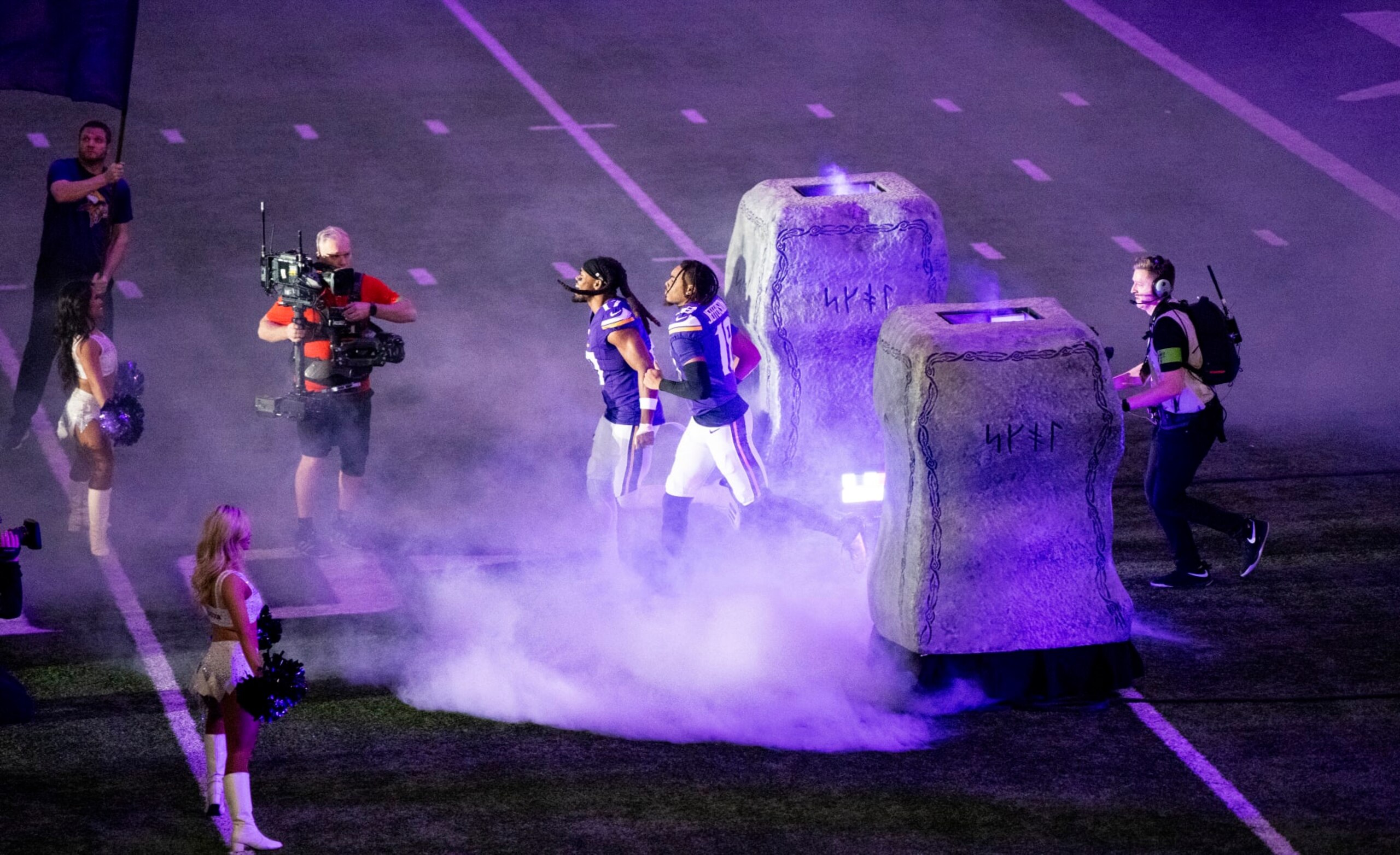 MINNEAPOLIS, MINNESOTA - DECEMBER 31: Justin Jefferson #18 and K.J. Osborn #17 of the Minnesota Vikings take the field before the game against the Green Bay Packers at U.S. Bank Stadium on December 31, 2023 in Minneapolis, Minnesota. (Photo by Stephen Maturen/Getty Images)