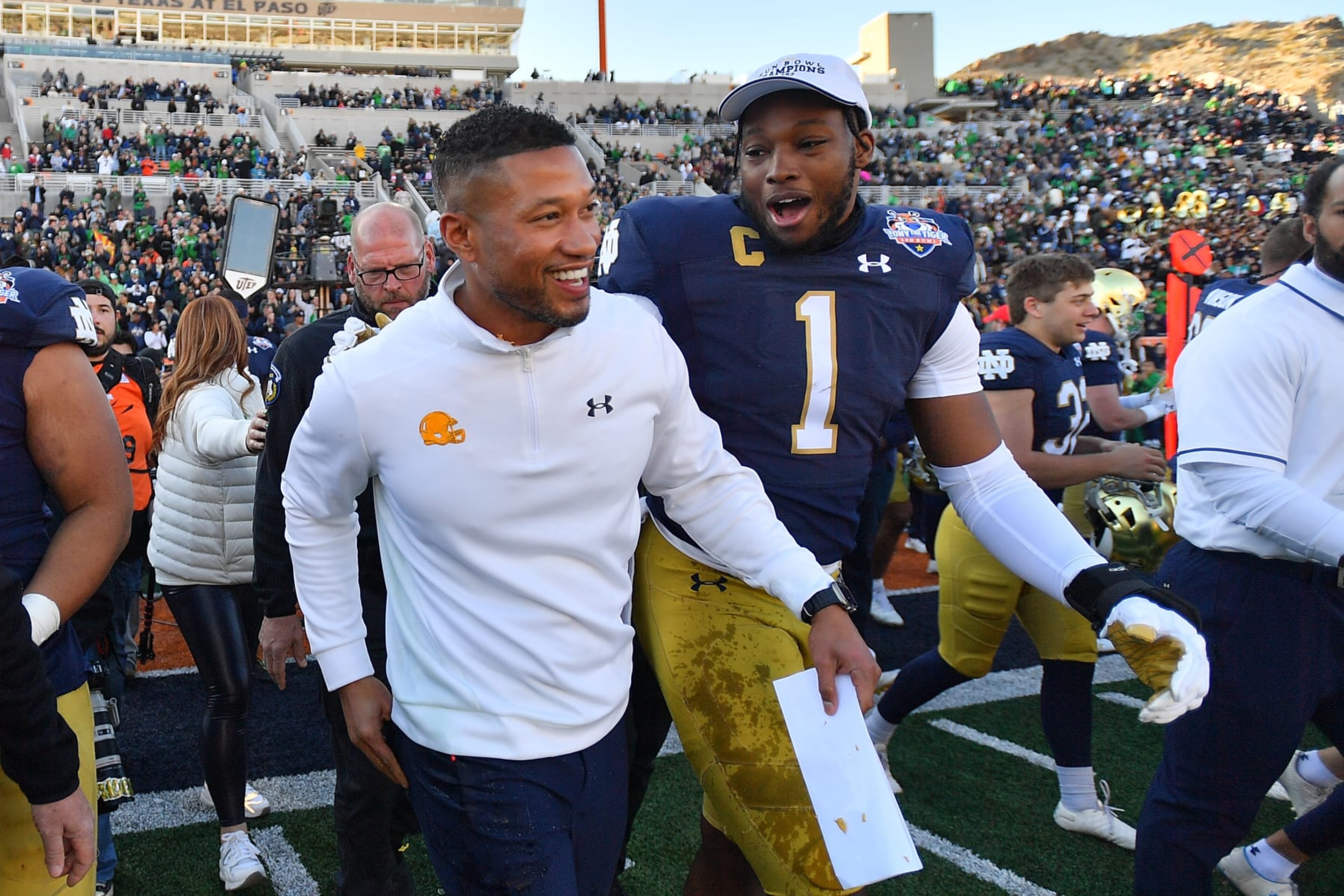 EL PASO, TEXAS - DECEMBER 29: Head coach Marcus Freeman (L) and defensive lineman Javontae Jean-Baptiste #1 of the Notre Dame Fighting Irish celebrate after the Fighting Irish defeated the Oregon State Beavers 40-8 in the Tony the Tiger Sun Bowl game at Sun Bowl Stadium on December 29, 2023 in El Paso, Texas. (Photo by Sam Wasson/Getty Images)