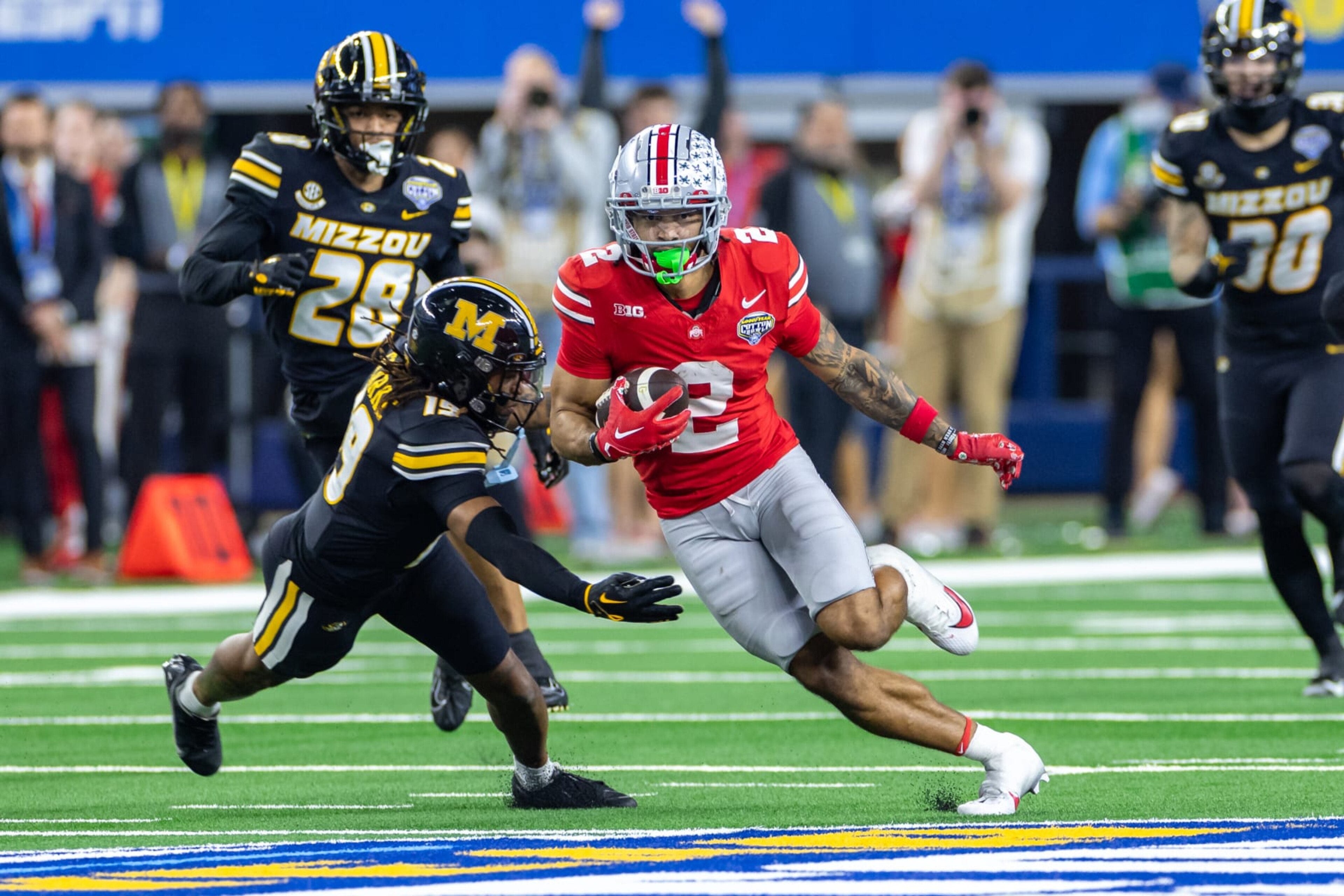 ARLINGTON, TX - DECEMBER 29: Ohio State Buckeyes wide receiver Emeka Egbuka (#2) runs up field after a catch during the Goodyear Cotton Bowl Classic football game between the Ohio State Buckeyes and Missouri Tigers on December 29, 2023 at AT&T Stadium in Arlington, TX.  (Photo by Matthew Visinsky/Icon Sportswire via Getty Images)
