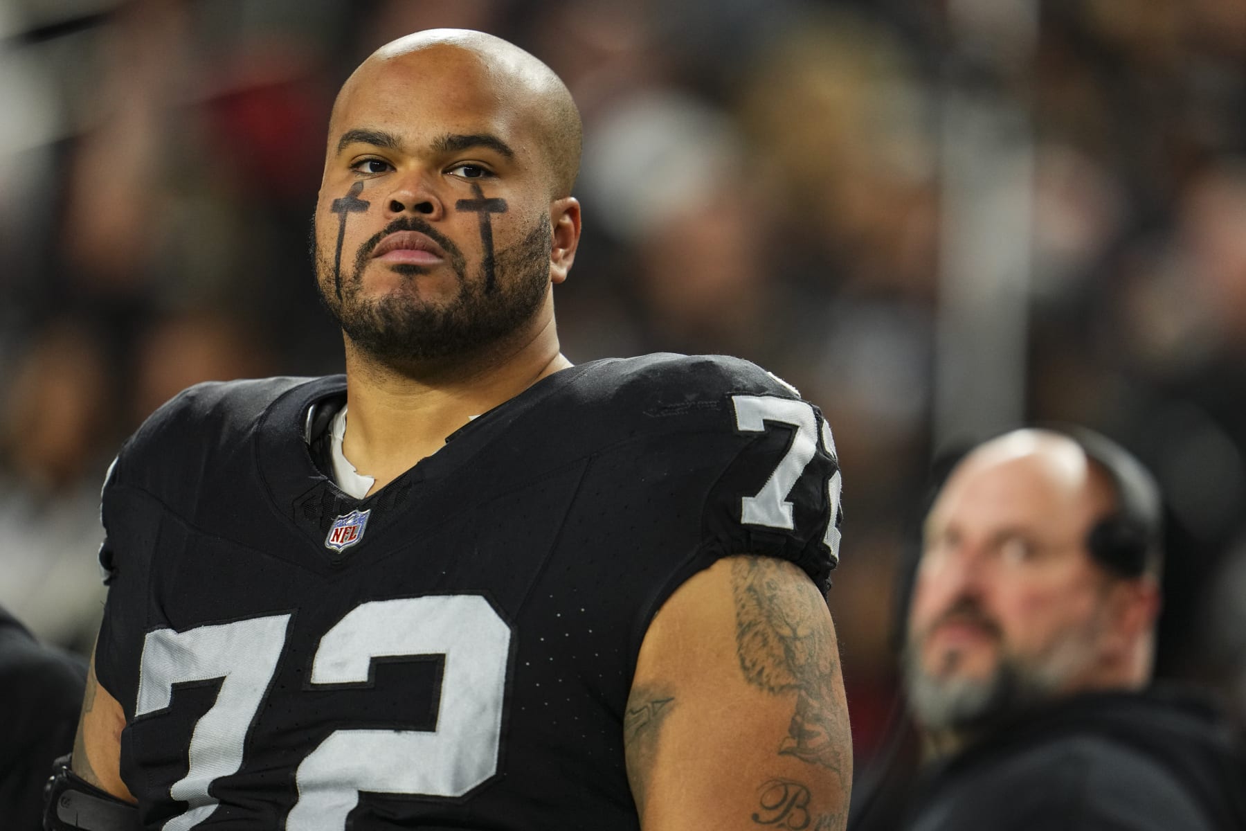 LAS VEGAS, NV - DECEMBER 14: Jermaine Eluemunor #72 of the Las Vegas Raiders looks on from the sideline prior to an NFL football game against the Los Angeles Chargers at Allegiant Stadium on December 14, 2023 in Las Vegas, Nevada. (Photo by Cooper Neill/Getty Images) LAS VEGAS, NV - DECEMBER 14: Jermaine Eluemunor #72 of the Las Vegas Raiders looks on from the sideline prior to an NFL football game against the Los Angeles Chargers at Allegiant Stadium on December 14, 2023 in Las Vegas, Nevada. (Photo by Cooper Neill/Getty Images)