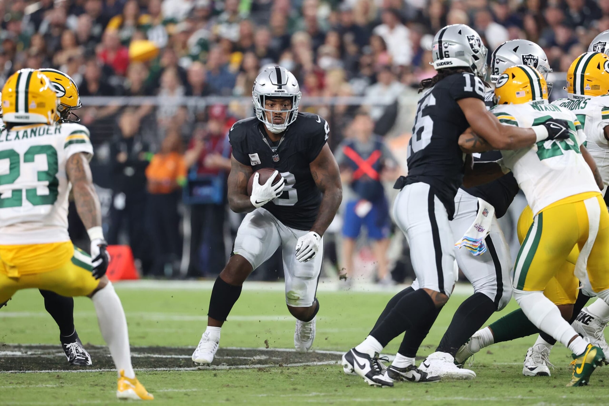 LAS VEGAS, NEVADA - OCTOBER 09: Josh Jacobs #8 of the Las Vegas Raiders runs the ball during the first quarter against the Green Bay Packers at Allegiant Stadium on October 09, 2023 in Las Vegas, Nevada. (Photo by Ian Maule/Getty Images)