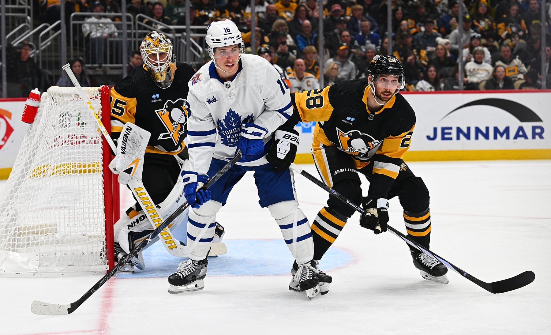 PITTSBURGH, PENNSYLVANIA - NOVEMBER 25: Mitchell Marner #16 of the Toronto Maple Leafs battles for position with Marcus Pettersson #28 of the Pittsburgh Penguins in the second period during the game at PPG PAINTS Arena on November 25, 2023 in Pittsburgh, Pennsylvania. (Photo by Justin Berl/Getty Images)