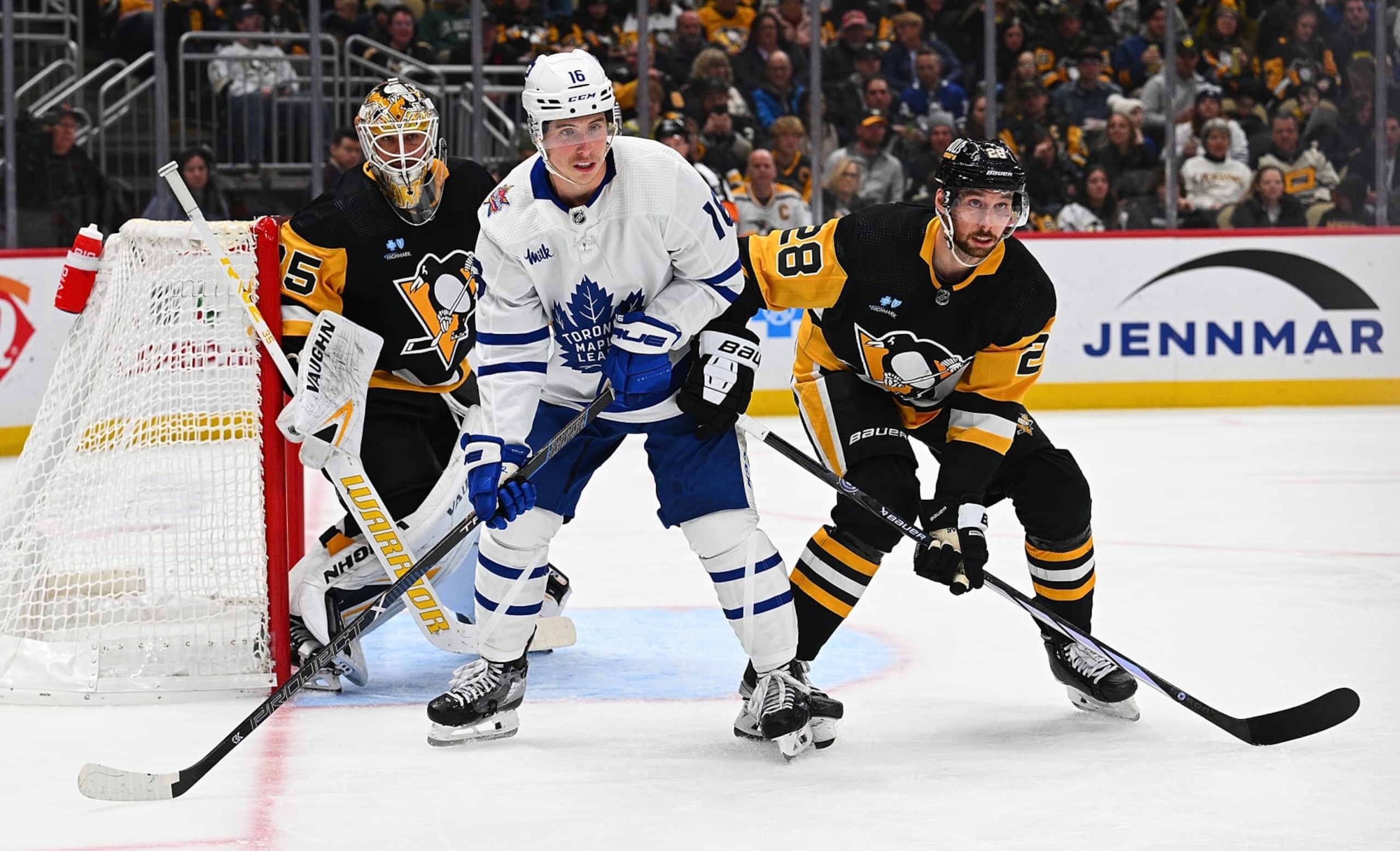 PITTSBURGH, PENNSYLVANIA - NOVEMBER 25: Mitchell Marner #16 of the Toronto Maple Leafs battles for position with Marcus Pettersson #28 of the Pittsburgh Penguins in the second period during the game at PPG PAINTS Arena on November 25, 2023 in Pittsburgh, Pennsylvania. (Photo by Justin Berl/Getty Images)