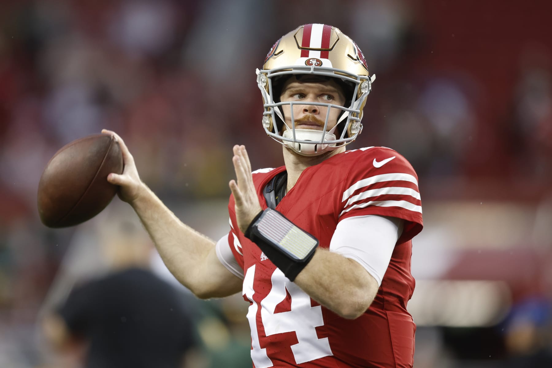 SANTA CLARA, CALIFORNIA - JANUARY 20: Sam Darnold #14 of the San Francisco 49ers warms up before the NFC Divisional Playoffs against the Green Bay Packers at Levi's Stadium on January 20, 2024 in Santa Clara, California. (Photo by Lachlan Cunningham/Getty Images)