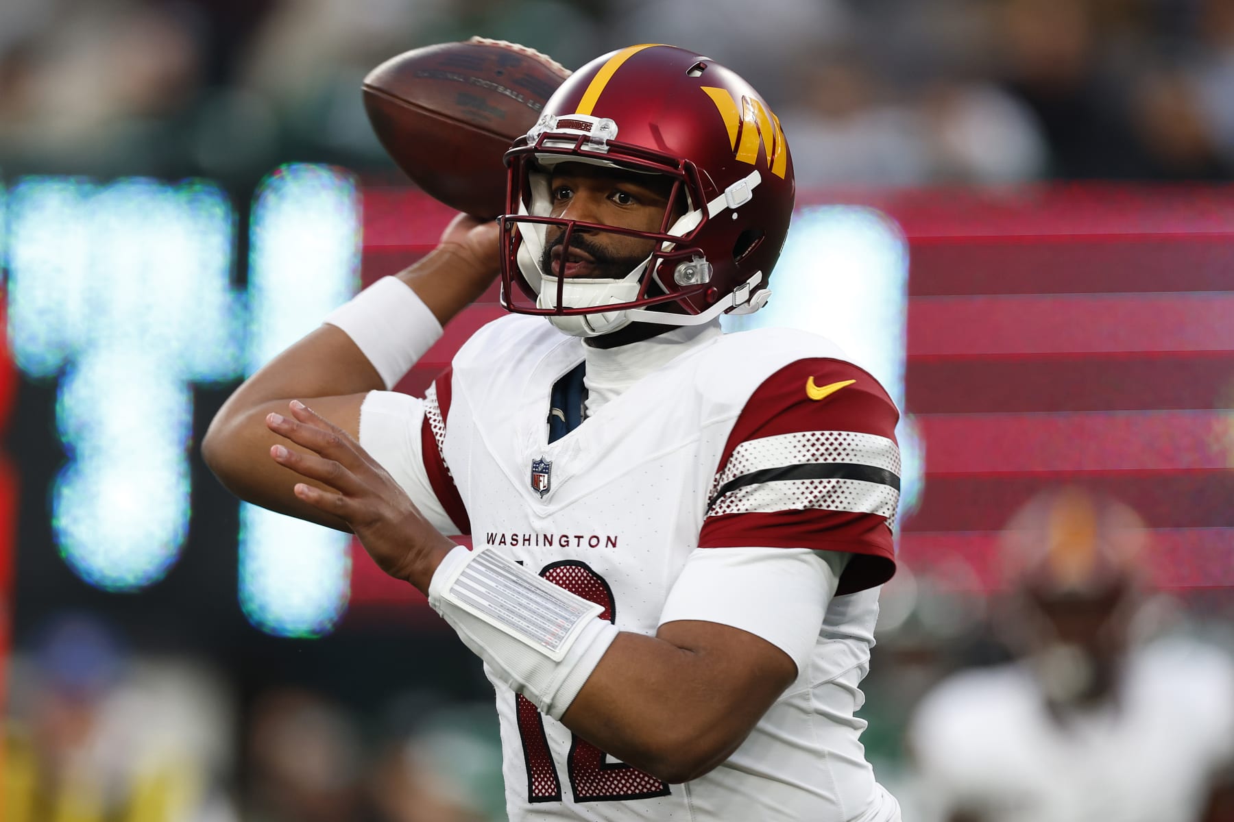 EAST RUTHERFORD, NEW JERSEY - DECEMBER 24: Jacoby Brissett #12 of the Washington Commanders looks to pass during the second half against the New York Jets at MetLife Stadium on December 24, 2023 in East Rutherford, New Jersey. (Photo by Rich Schultz/Getty Images) EAST RUTHERFORD, NEW JERSEY - DECEMBER 24: Jacoby Brissett #12 of the Washington Commanders looks to pass during the second half against the New York Jets at MetLife Stadium on December 24, 2023 in East Rutherford, New Jersey. (Photo by Rich Schultz/Getty Images)