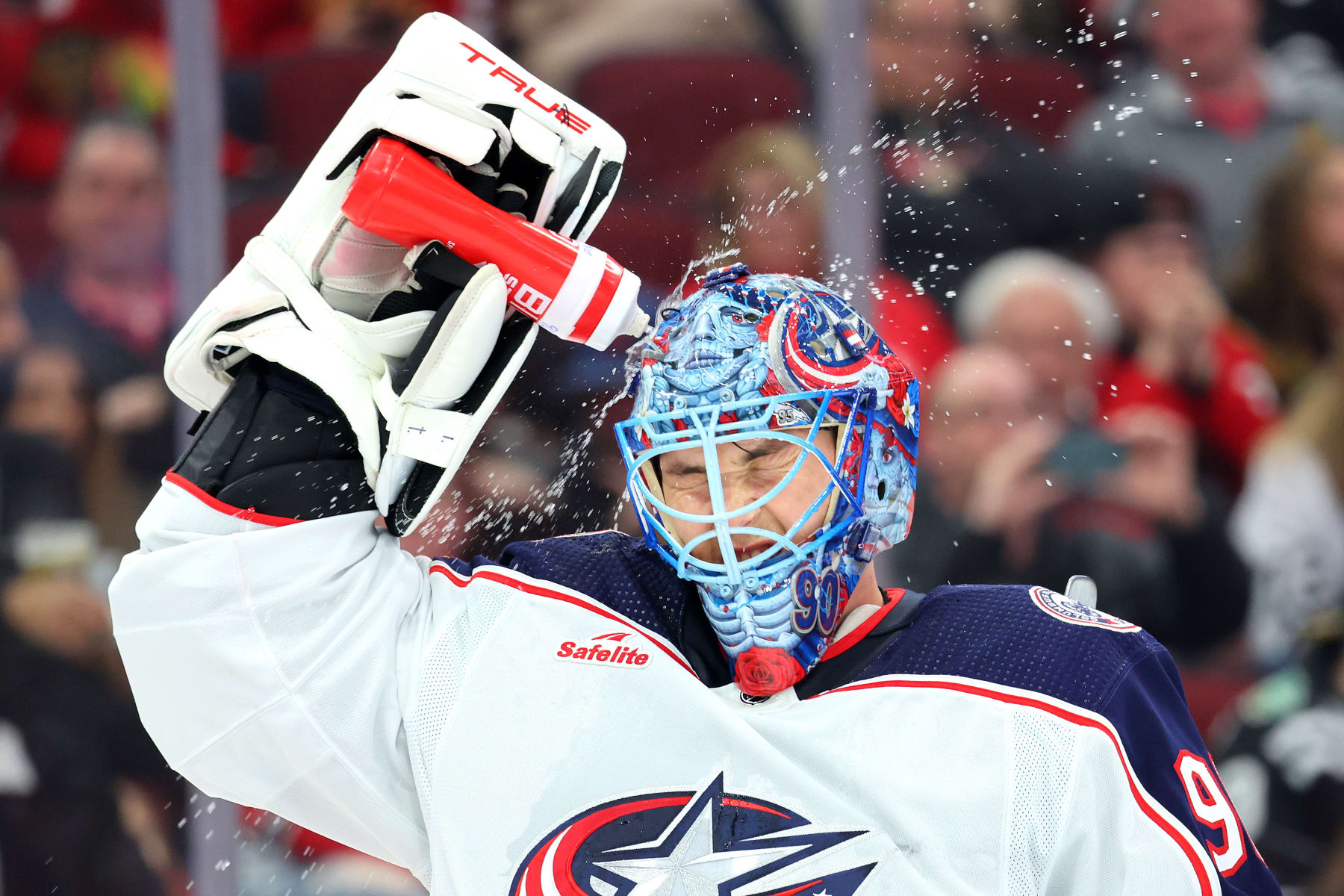 CHICAGO, ILLINOIS - MARCH 02: Elvis Merzlikins #90 of the Columbus Blue Jackets cools off against the Chicago Blackhawks during the first period at the United Center on March 02, 2024 in Chicago, Illinois. (Photo by Michael Reaves/Getty Images)