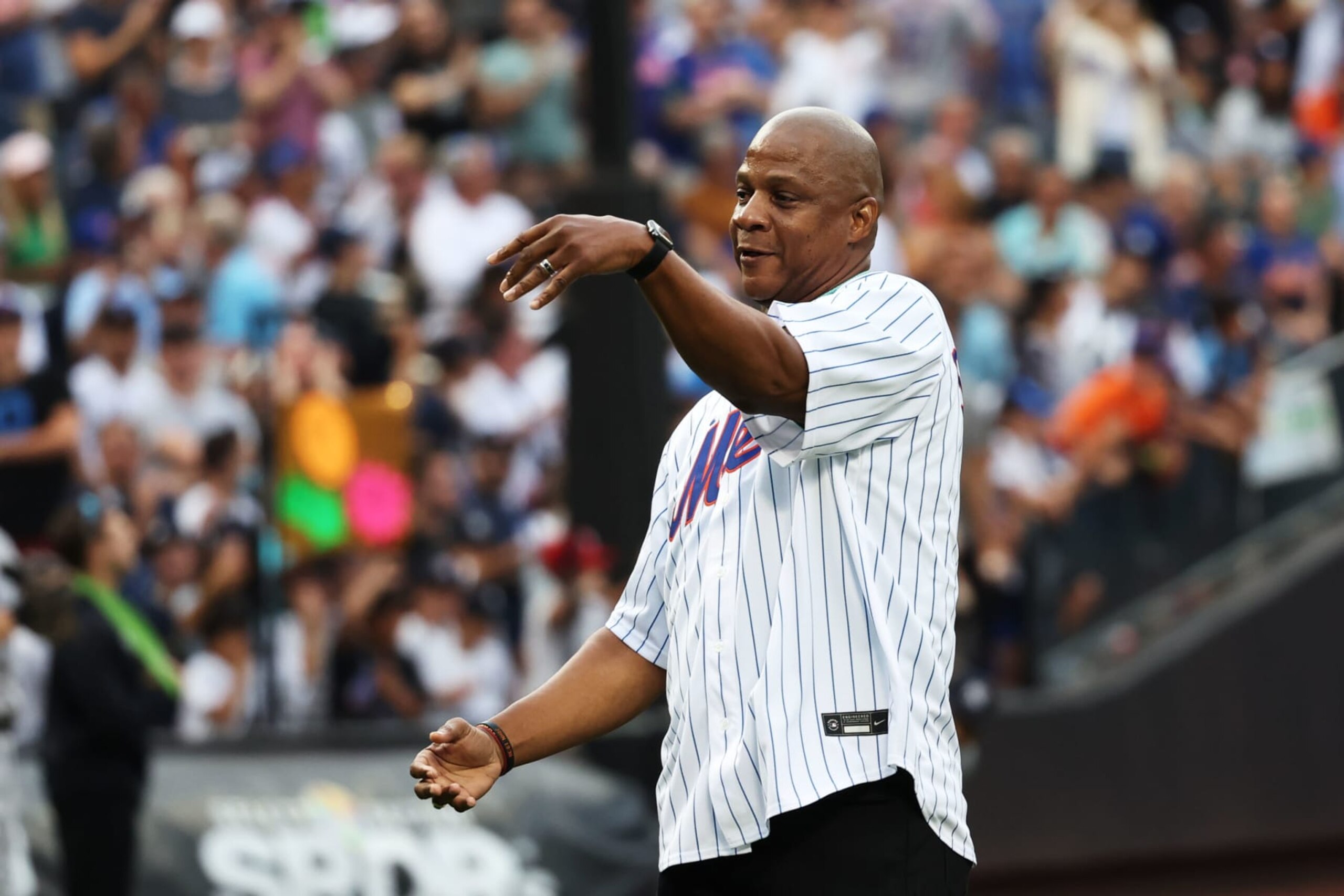 NEW YORK, NY - JULY 26: Darryl Strawberry #18 a former New York Mets player throws the ceremonial first pitch prior to the game between the New York Yankees and the New York Mets at Citi Field on Tuesday, July 26, 2022 in New York, New York. (Photo by Mary DeCicco/MLB Photos via Getty Images)