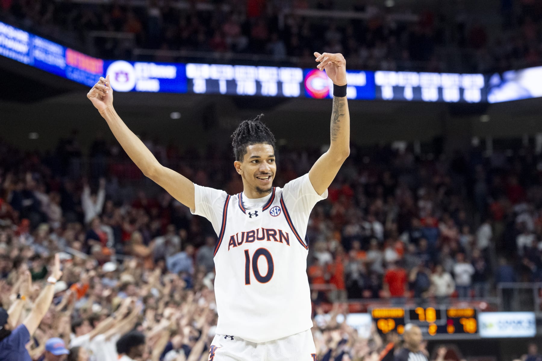 AUBURN, ALABAMA - MARCH 09: Chad Baker-Mazara #10 of the Auburn Tigers reacts to a big play during the second half of their game against the Georgia Bulldogs at Neville Arena on March 09, 2024 in Auburn, Alabama. (Photo by Michael Chang/Getty Images)