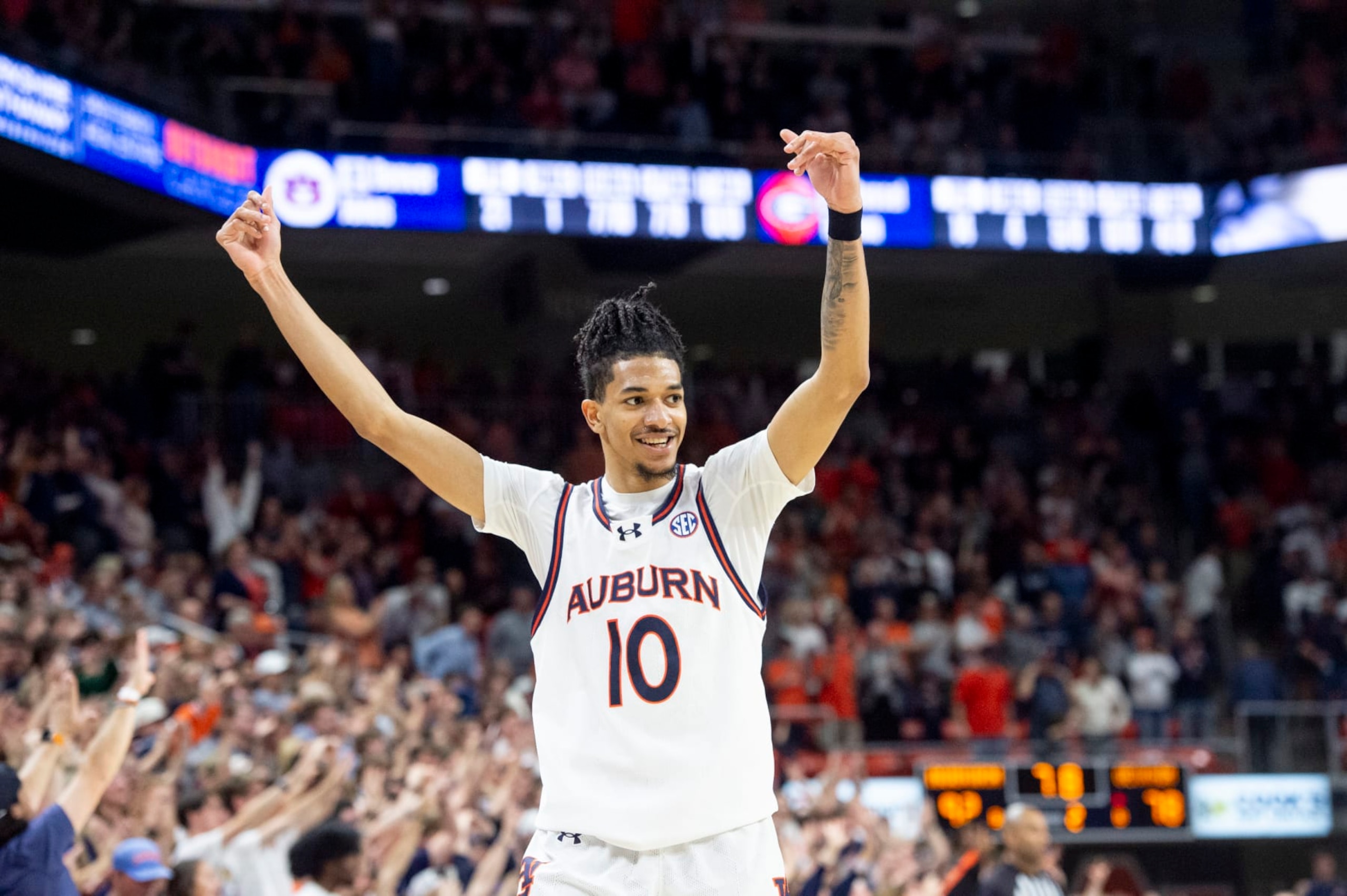 AUBURN, ALABAMA - MARCH 09: Chad Baker-Mazara #10 of the Auburn Tigers reacts to a big play during the second half of their game against the Georgia Bulldogs at Neville Arena on March 09, 2024 in Auburn, Alabama. (Photo by Michael Chang/Getty Images)