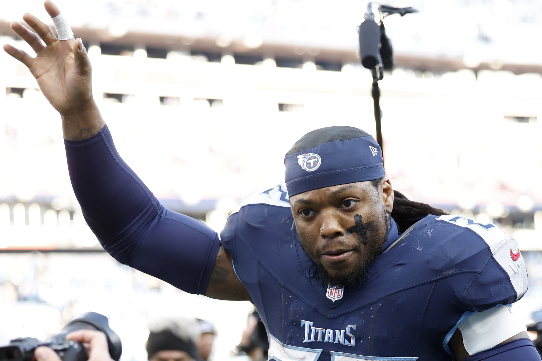 NASHVILLE, TENNESSEE - JANUARY 07: Derrick Henry #22 of the Tennessee Titans runs off the field after the game against the Jacksonville Jaguars at Nissan Stadium on January 07, 2024 in Nashville, Tennessee. (Photo by Wesley Hitt/Getty Images)