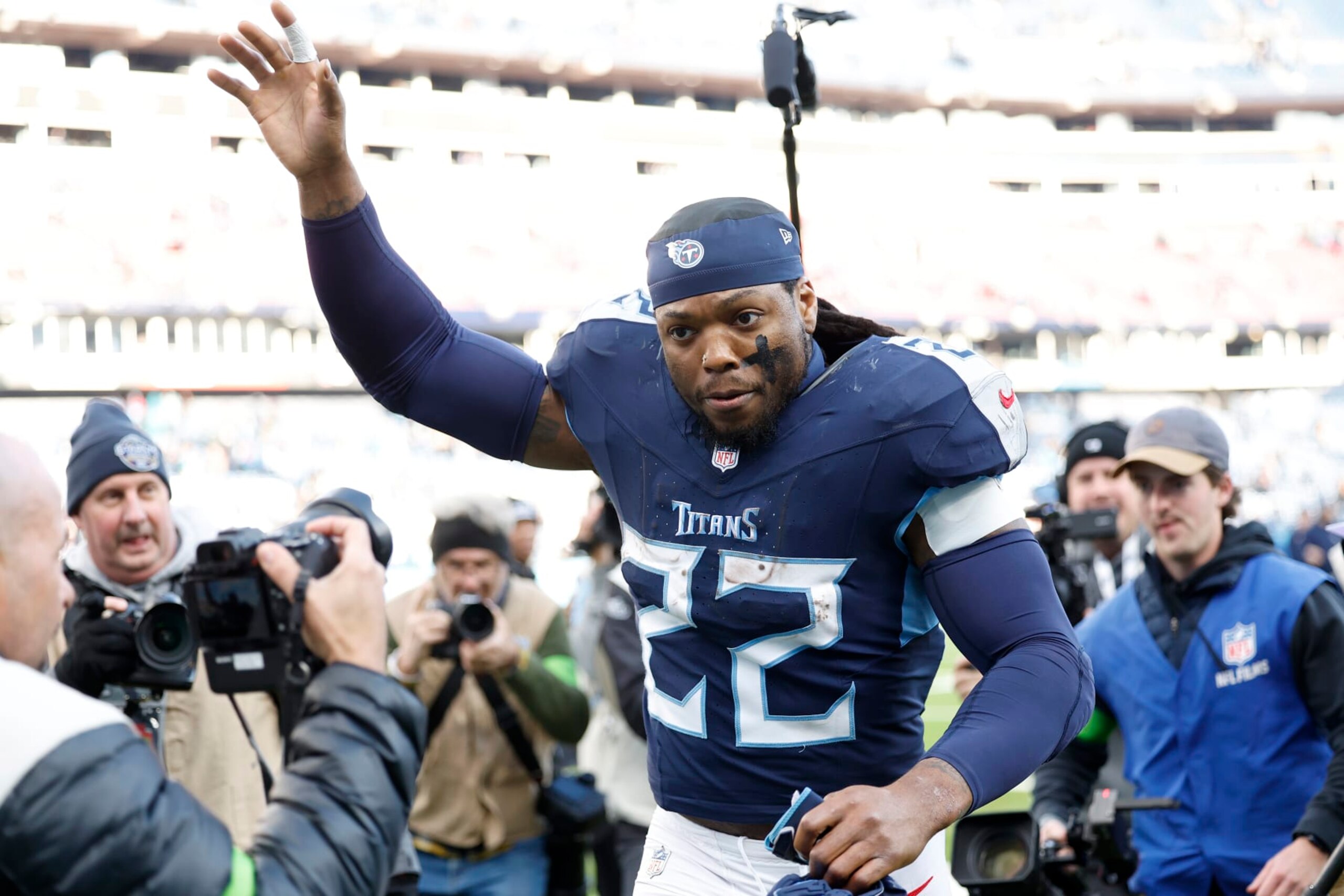 NASHVILLE, TENNESSEE - JANUARY 07: Derrick Henry #22 of the Tennessee Titans runs off the field after the game against the Jacksonville Jaguars at Nissan Stadium on January 07, 2024 in Nashville, Tennessee. (Photo by Wesley Hitt/Getty Images)