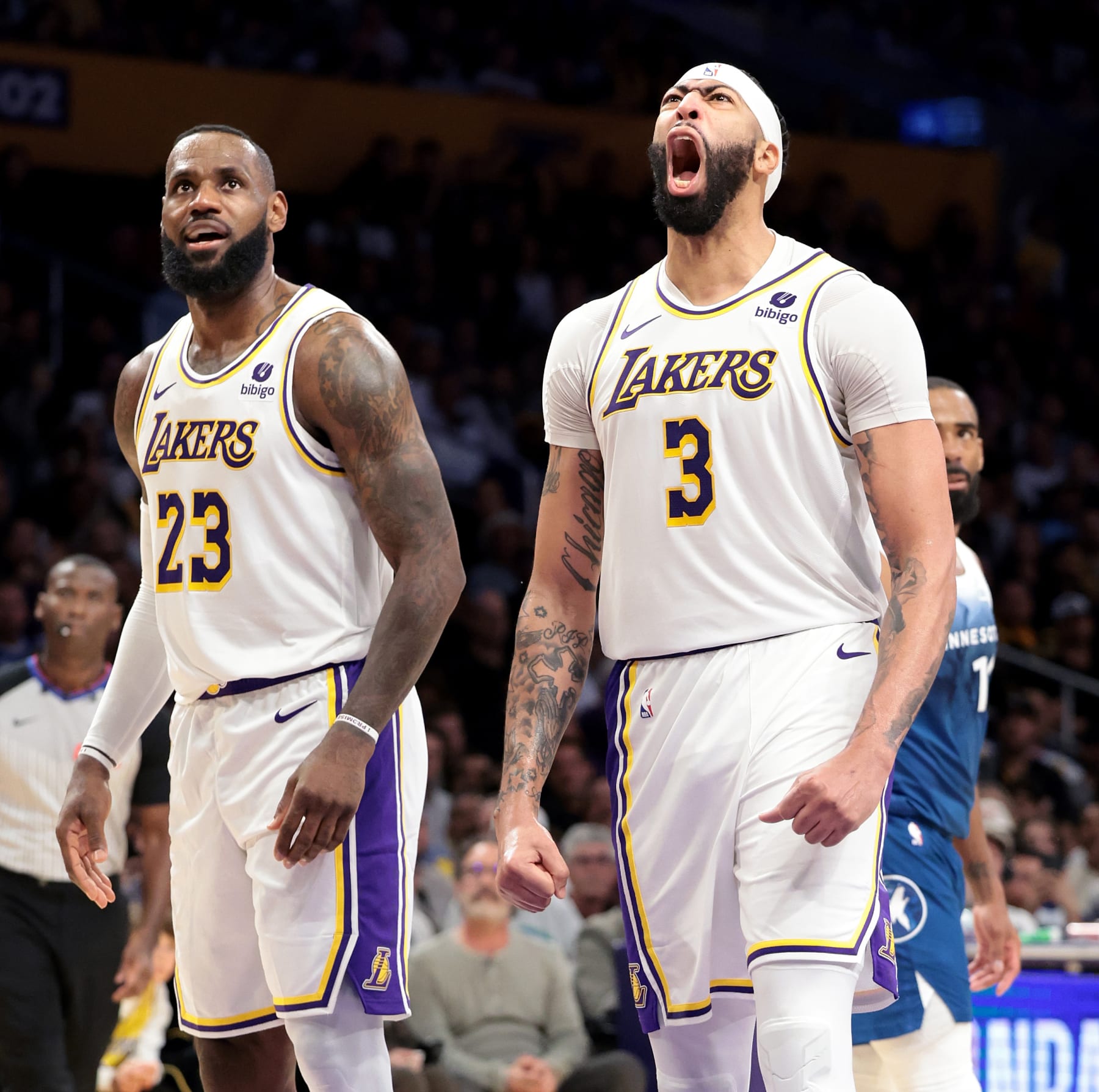 Los Angeles, California March 10, 2024-Lakers Anthony Davis (3) screams after being fouled and scoring a basket as LeBron James looks on against the Timberwolves in the fourth quarter at Crypto.com Arena Sunday. (Wally Skalij/Los Angeles Times via Getty Images)