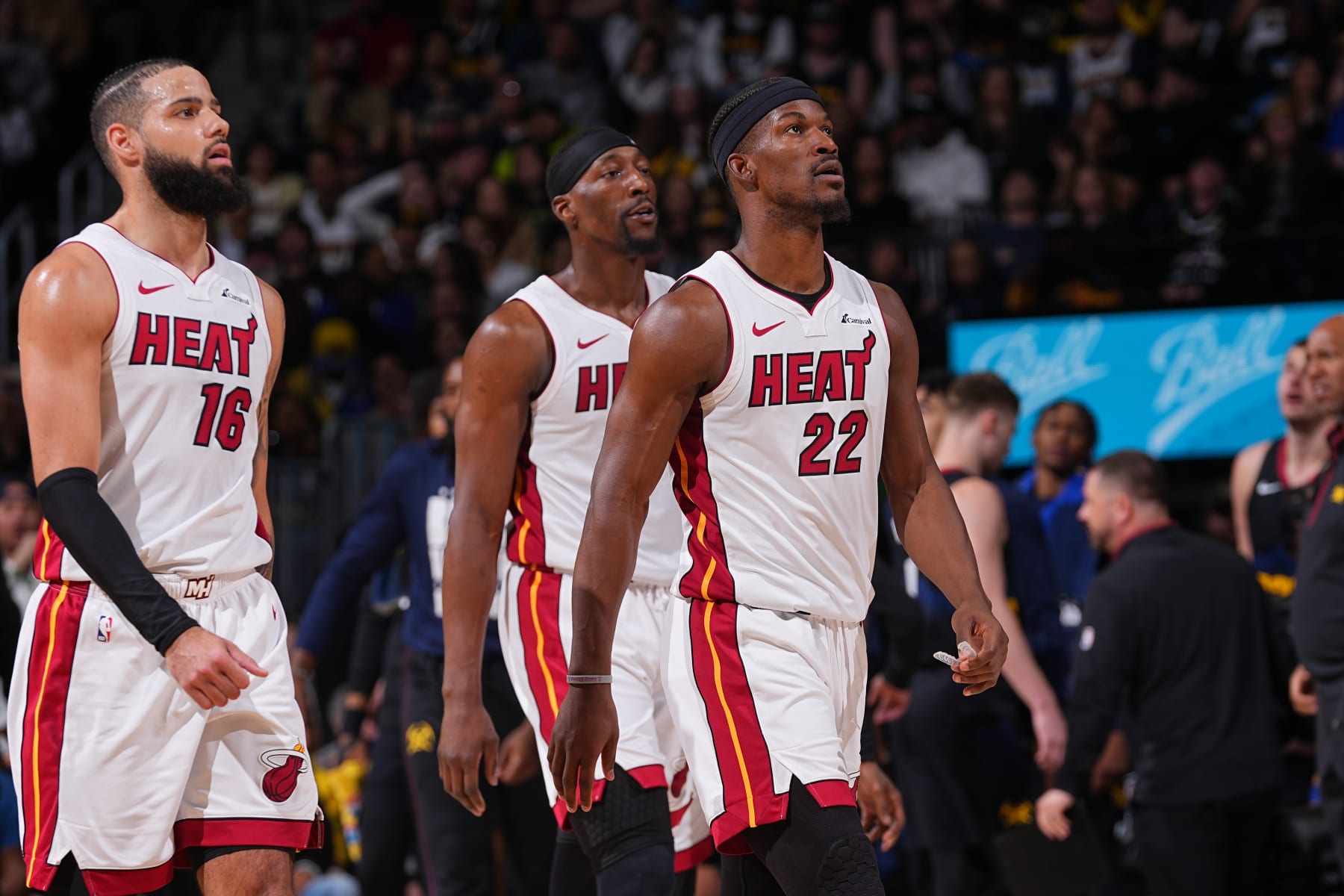 DENVER, CO - FEBRUARY 29: Caleb Martin #16, Bam Adebayo #13 and Jimmy Butler #22 of the Miami Heat look on during the game against the Denver Nuggets on February 29, 2024 at the Ball Arena in Denver, Colorado. NOTE TO USER: User expressly acknowledges and agrees that, by downloading and/or using this Photograph, user is consenting to the terms and conditions of the Getty Images License Agreement. Mandatory Copyright Notice: Copyright 2024 NBAE (Photo by Bart Young/NBAE via Getty Images)