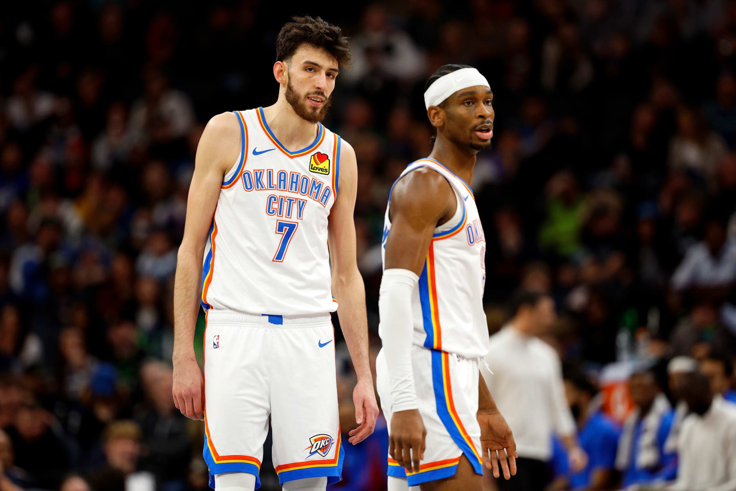 MINNEAPOLIS, MINNESOTA - JANUARY 20: Chet Holmgren #7 and Shai Gilgeous-Alexander #2 of the Oklahoma City Thunder look on against the Minnesota Timberwolves in the fourth quarter at Target Center on January 20, 2024 in Minneapolis, Minnesota. The Thunder defeated the Timberwolves 102-97. NOTE TO USER: User expressly acknowledges and agrees that, by downloading and or using this photograph, User is consenting to the terms and conditions of the Getty Images License Agreement. (Photo by David Berding/Getty Images)