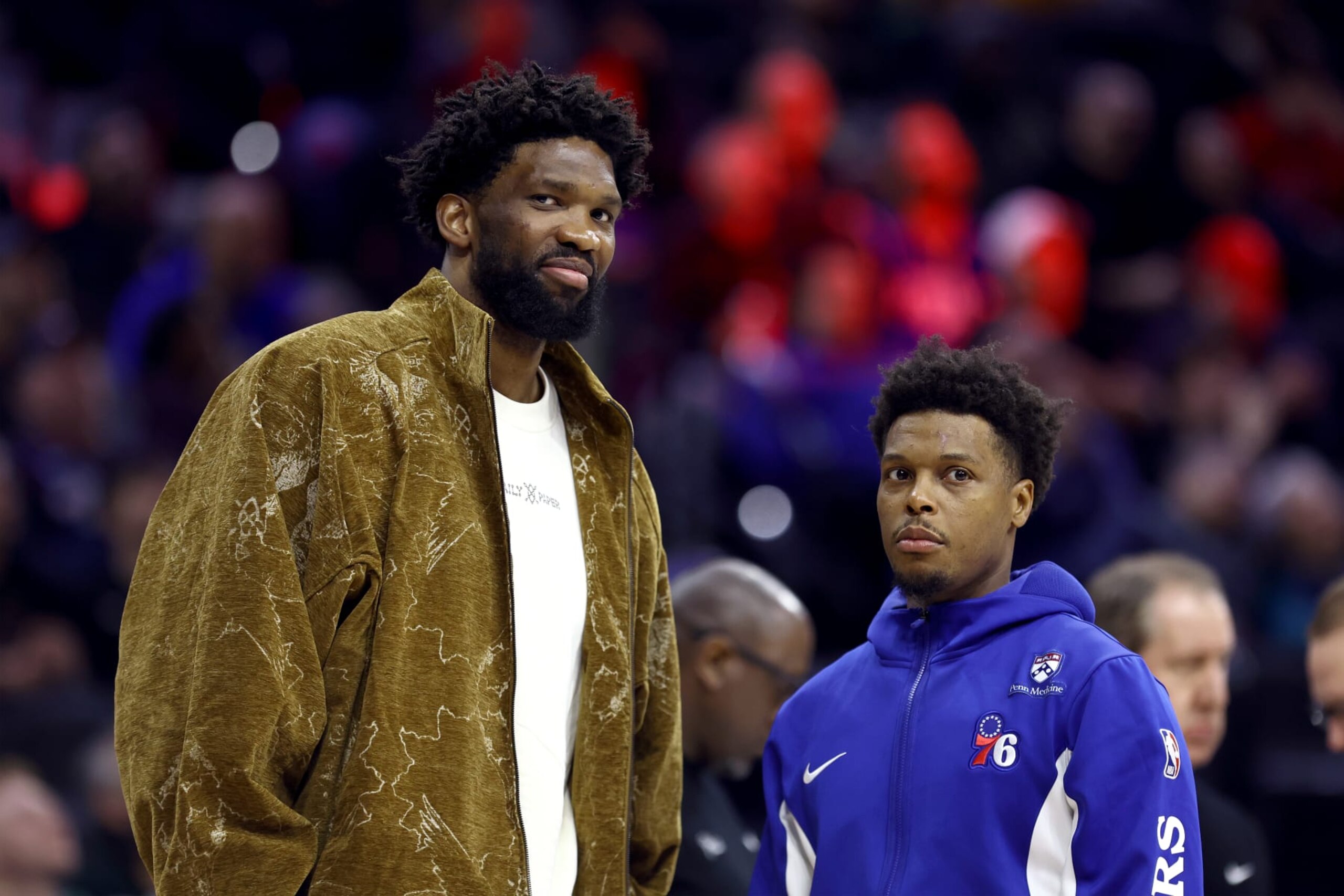 PHILADELPHIA, PENNSYLVANIA - MARCH 08: Joel Embiid #21 and Kyle Lowry #7 of the Philadelphia 76ers look on during the fourth quarter at the Wells Fargo Center on March 08, 2024 in Philadelphia, Pennsylvania. NOTE TO USER: User expressly acknowledges and agrees that, by downloading and or using this photograph, User is consenting to the terms and conditions of the Getty Images License Agreement.  (Photo by Tim Nwachukwu/Getty Images)