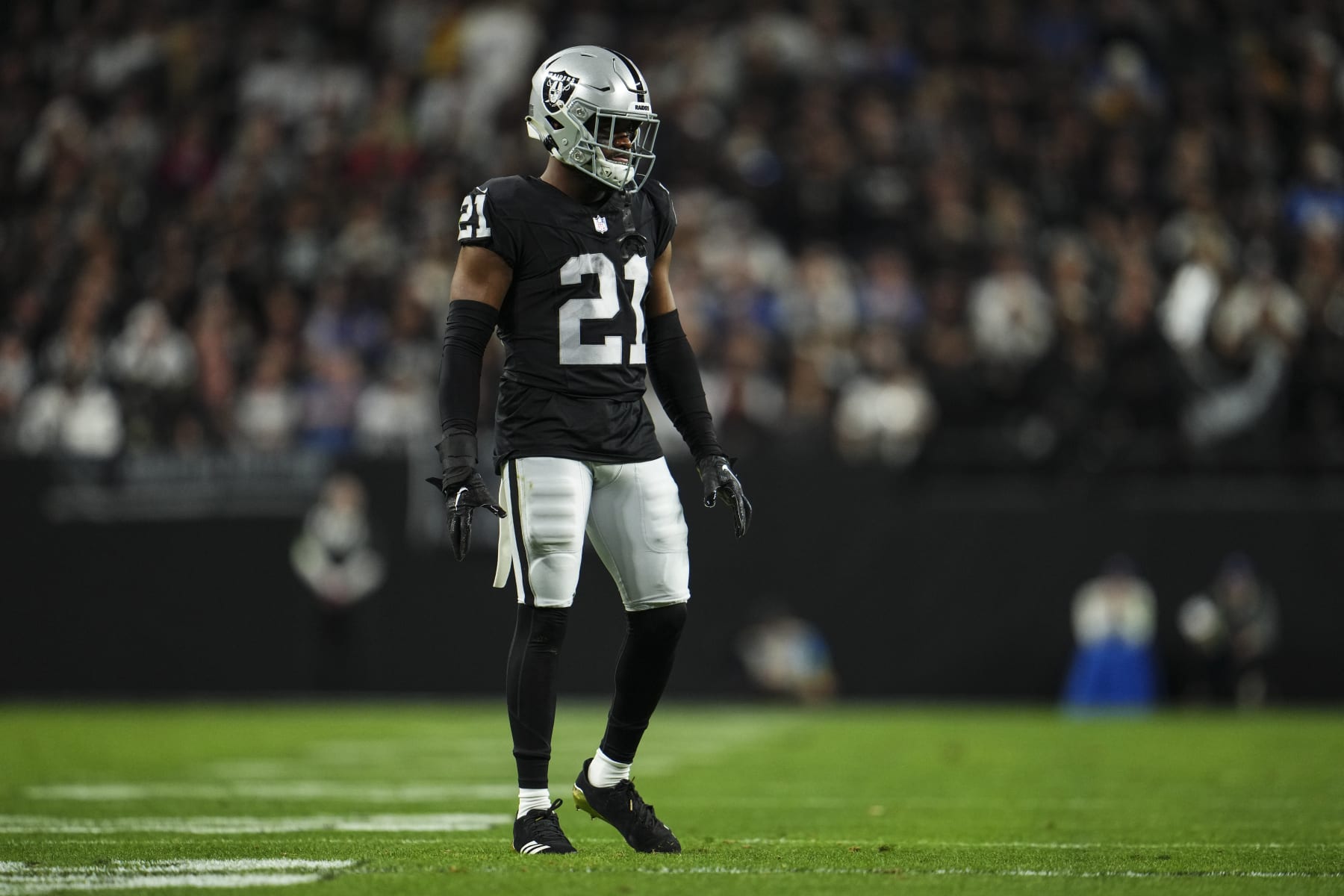 LAS VEGAS, NV - DECEMBER 14: Amik Robertson #21 of the Las Vegas Raiders looks on from the field during an NFL football game against the Los Angeles Chargers at Allegiant Stadium on December 14, 2023 in Las Vegas, Nevada. (Photo by Cooper Neill/Getty Images)