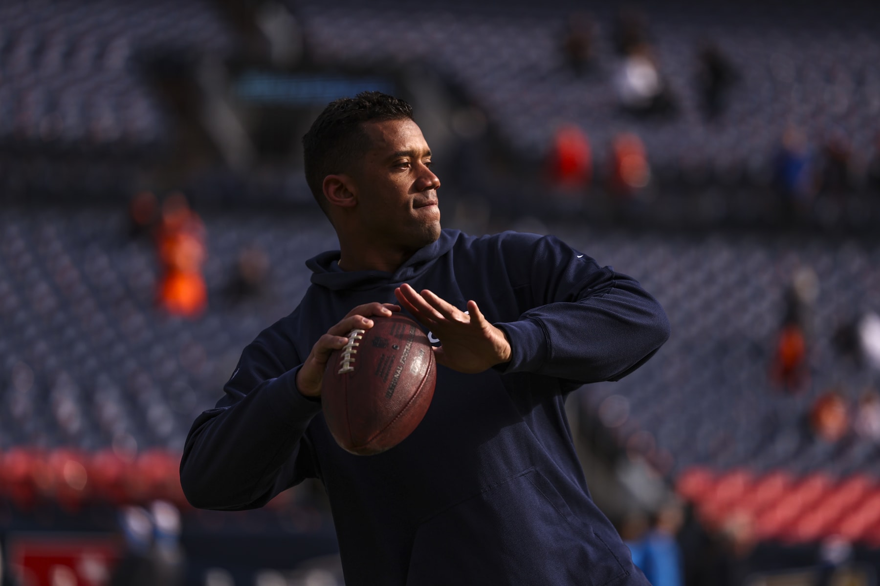 DENVER, CO - DECEMBER 31: Russell Wilson #3 of the Denver Broncos warms up prior to an NFL football game against the Los Angeles Chargers at Empower Field at Mile High on December 31, 2023 in Denver, Colorado. (Photo by Perry Knotts/Getty Images)