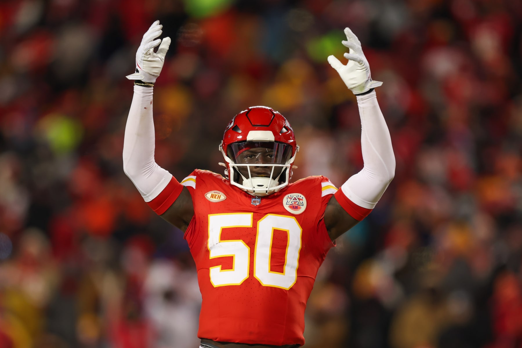 KANSAS CITY, MO - JANUARY 13: Kansas City Chiefs linebacker Willie Gay (50) raises his hands to fire up the crowd in the third quarter of an AFC Wild Card playoff game between the Miami Dolphins and Kansas City Chiefs on Jan 13, 2024 at GEHA Field at Arrowhead Stadium in Kansas City, MO. (Photo by Scott Winters/Icon Sportswire via Getty Images)