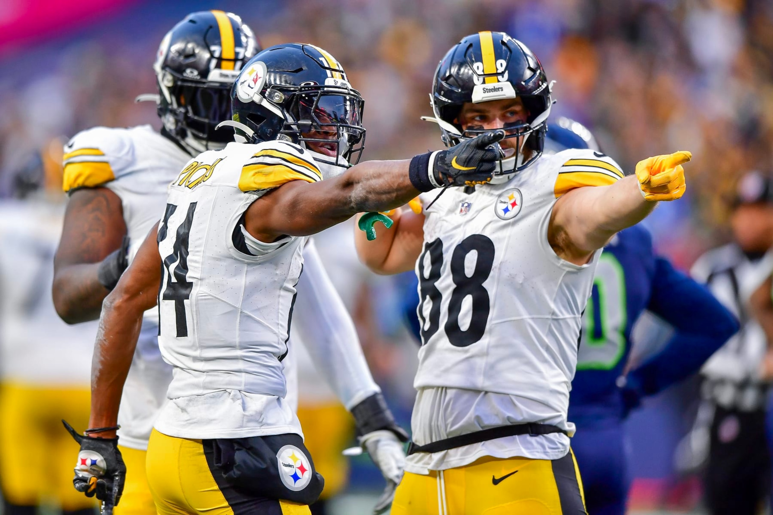 SEATTLE, WASHINGTON - DECEMBER 31: George Pickens #14 celebrates a first down with Pat Freiermuth #88 of the Pittsburgh Steelers during the fourth quarter of a game against the Seattle Seahawks at Lumen Field on December 31, 2023 in Seattle, Washington. (Photo by Jane Gershovich/Getty Images)